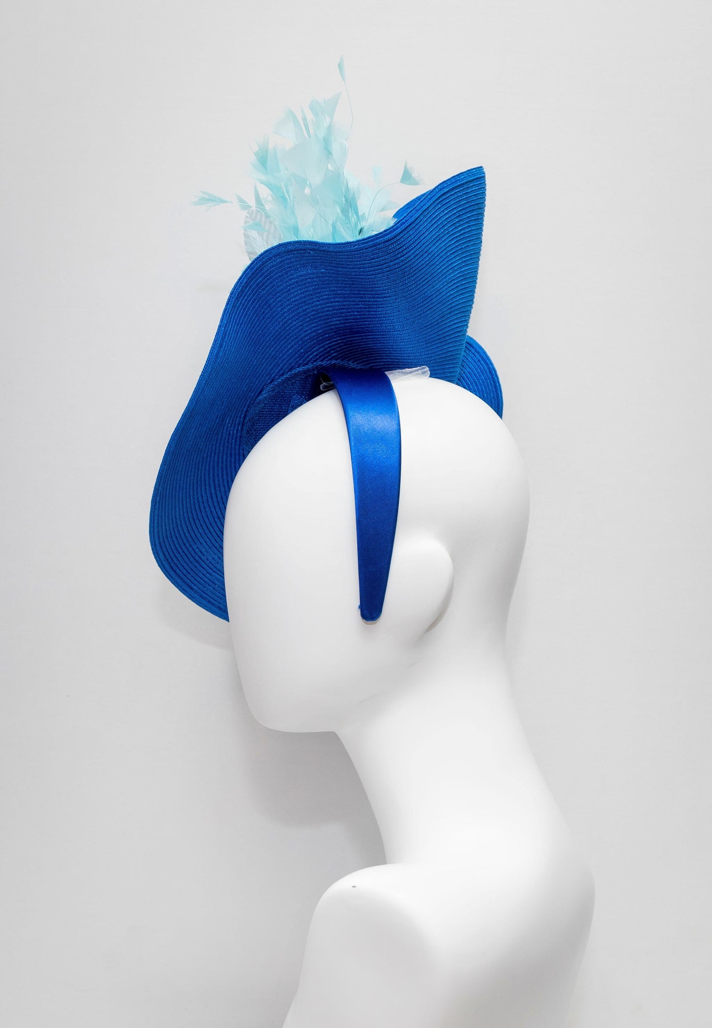kentucky derby hat fascinator royal blue woven base with navy rose flower light blue leaves aqua turquoise blue feathers