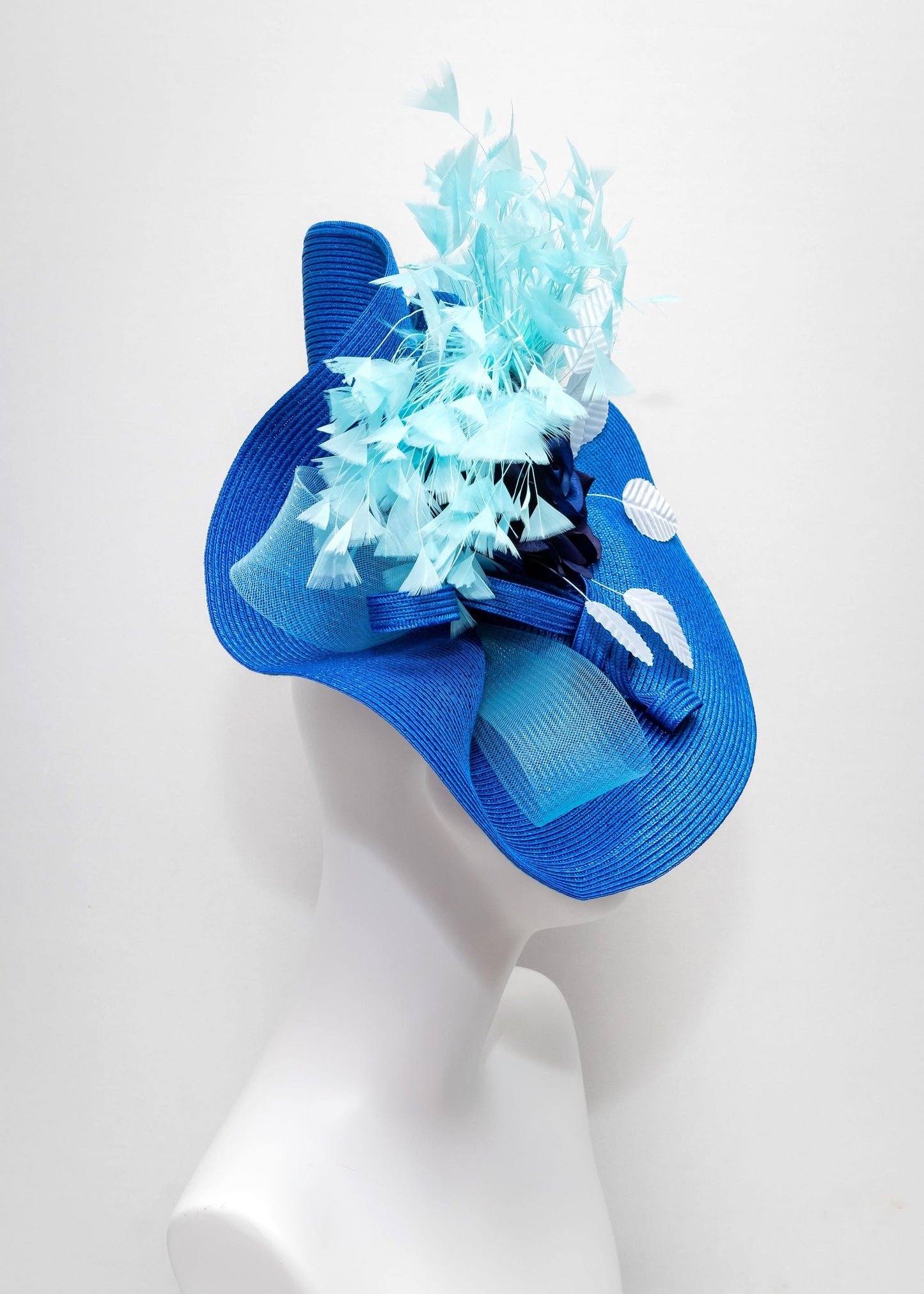 kentucky derby hat fascinator royal blue woven base with navy rose flower light blue leaves aqua turquoise blue feathers