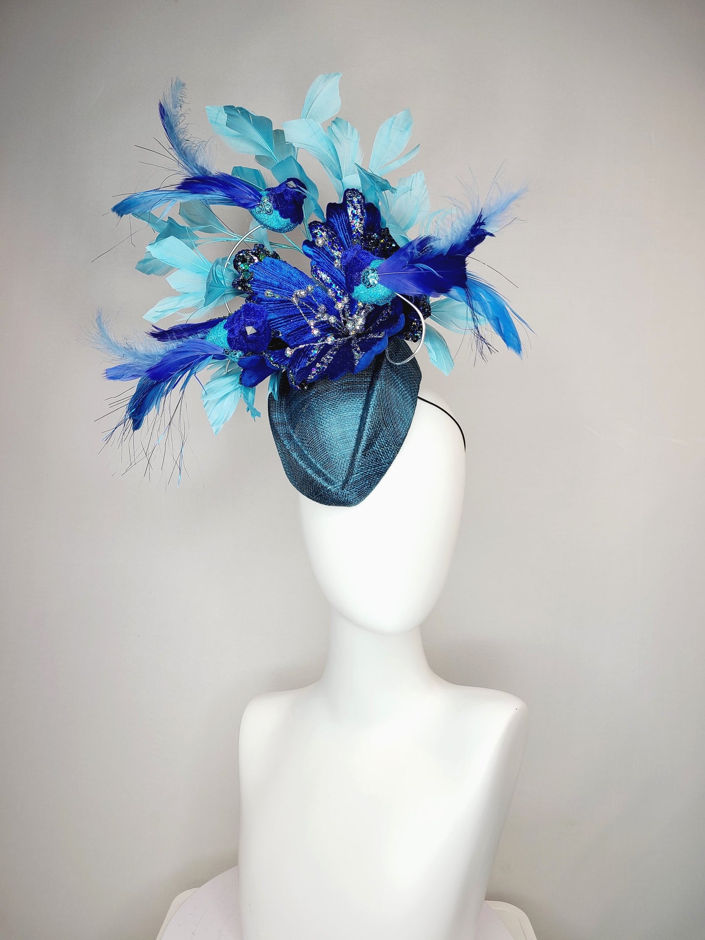 kentucky derby hat fascinator teal blue cocktail hat with royal blue flying feather 2 birds velvet glitter flower light blue feathers
