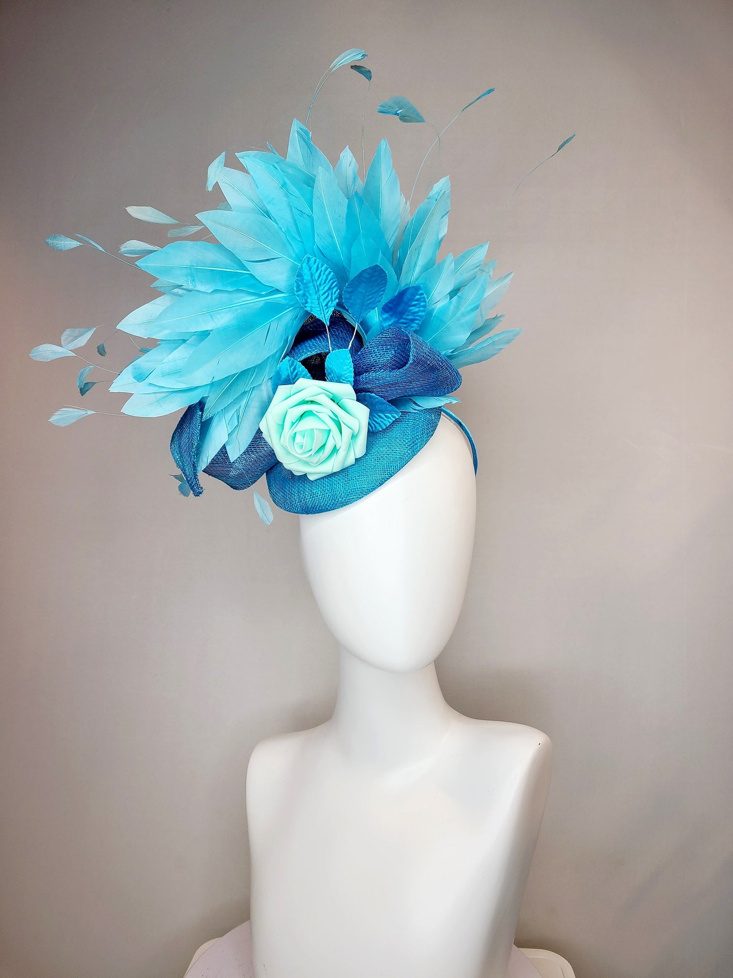 kentucky derby hat fascinator turquoise blue sinamay with bow and curls mint blue green rose blue leaves and blue aqua large feathers