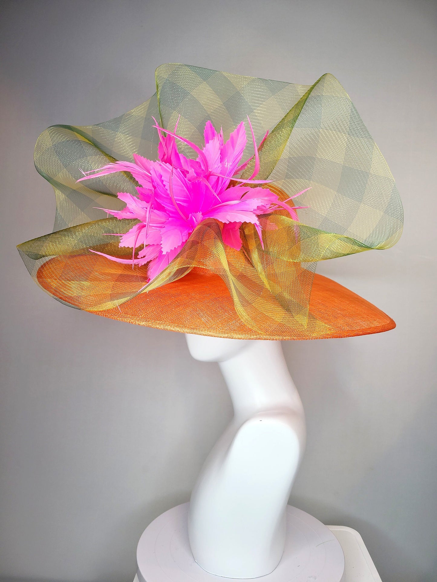 kentucky derby hat large wide brim sinamay orange hat with large pink feather pouf decor with green gingham plaid crinoline