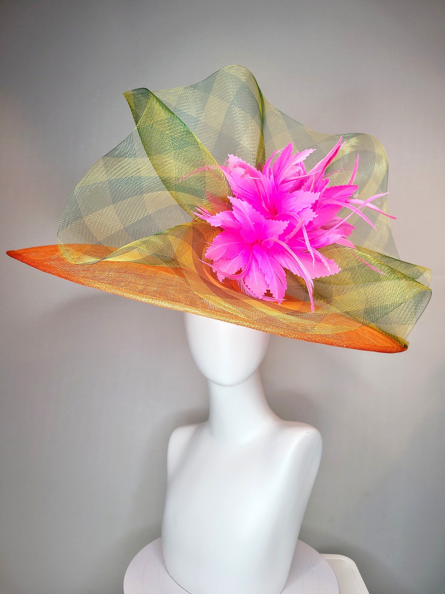 kentucky derby hat large wide brim sinamay orange hat with large pink feather pouf decor with green gingham plaid crinoline