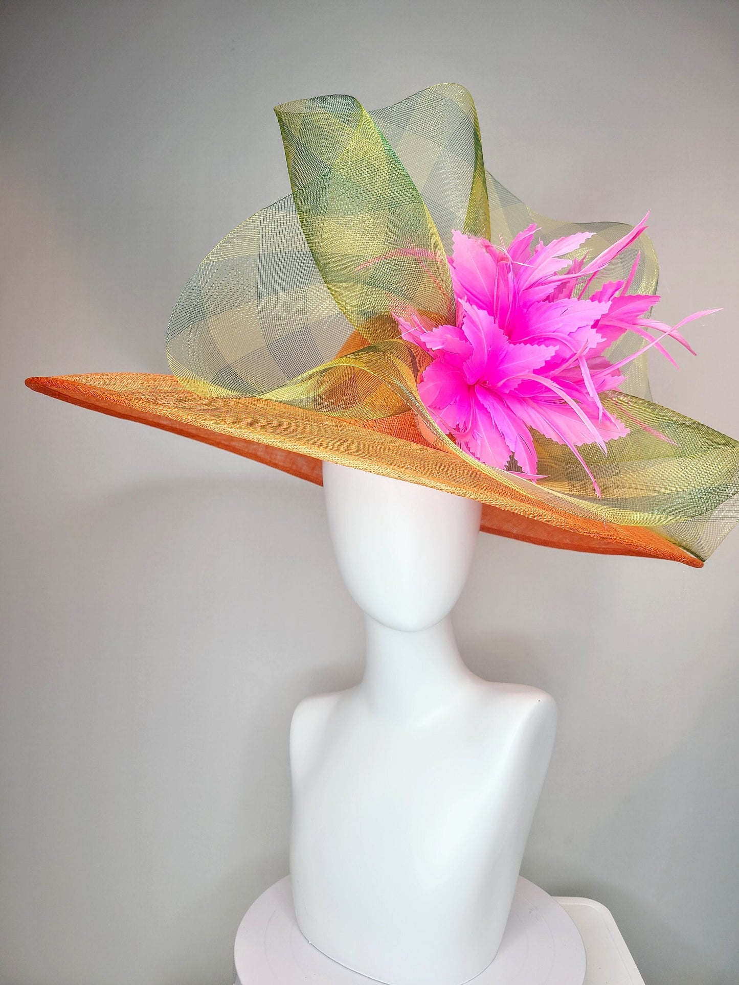 kentucky derby hat large wide brim sinamay orange hat with large pink feather pouf decor with green gingham plaid crinoline