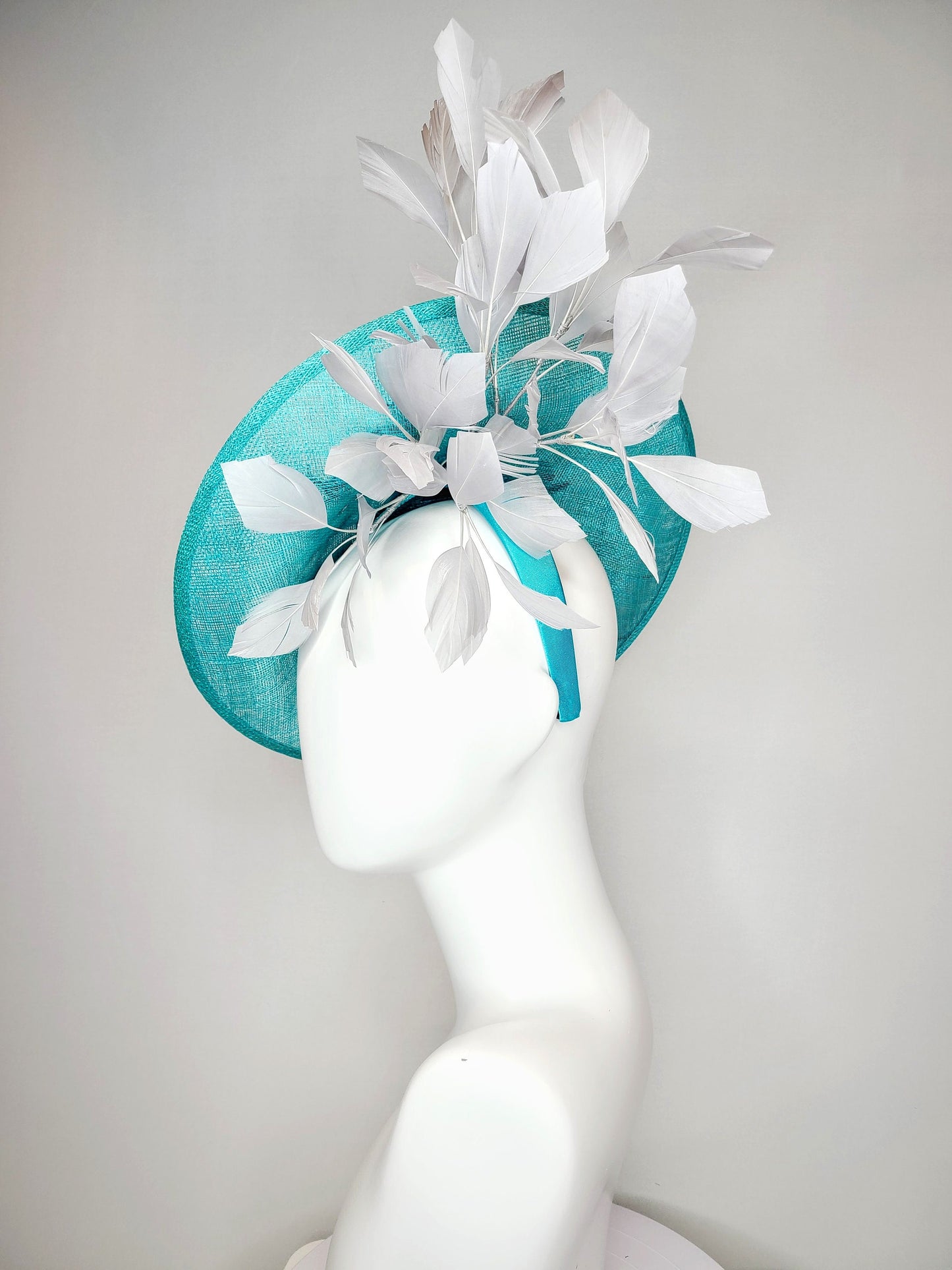 kentucky derby hat fascinator teal blue green sinamay saucer with silver gray black embroidered flowers with silver gray feathers
