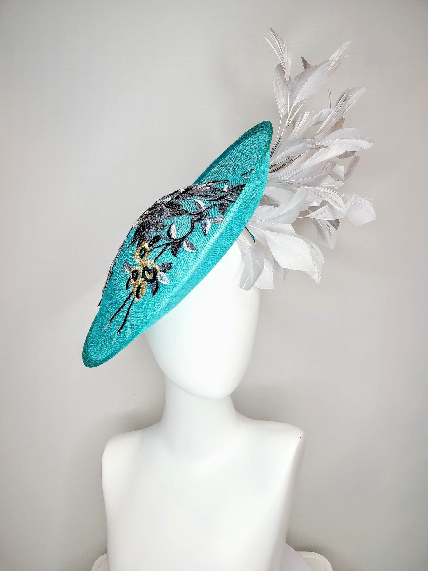 kentucky derby hat fascinator teal blue green sinamay saucer with silver gray black embroidered flowers with silver gray feathers