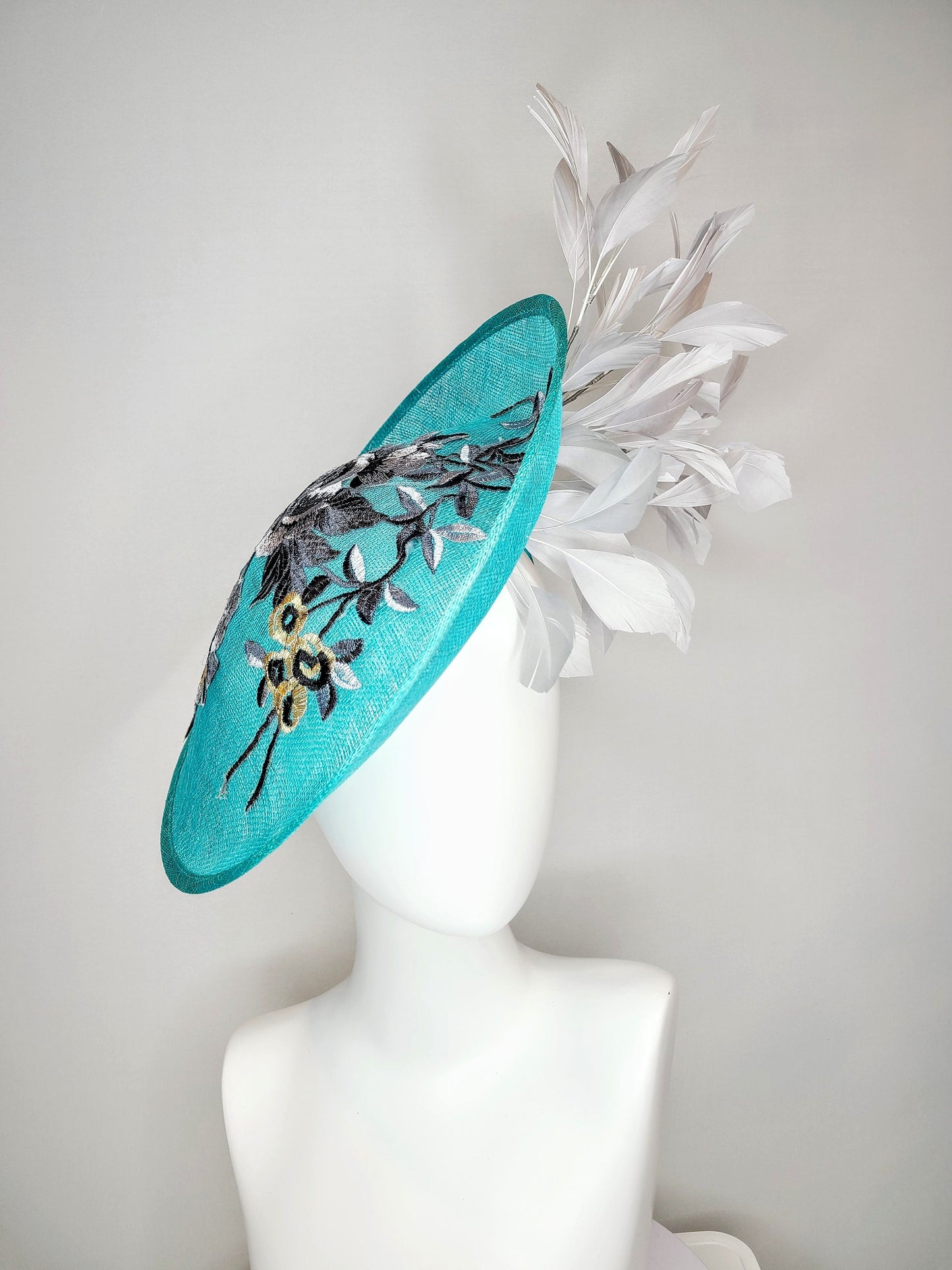 kentucky derby hat fascinator teal blue green sinamay saucer with silver gray black embroidered flowers with silver gray feathers