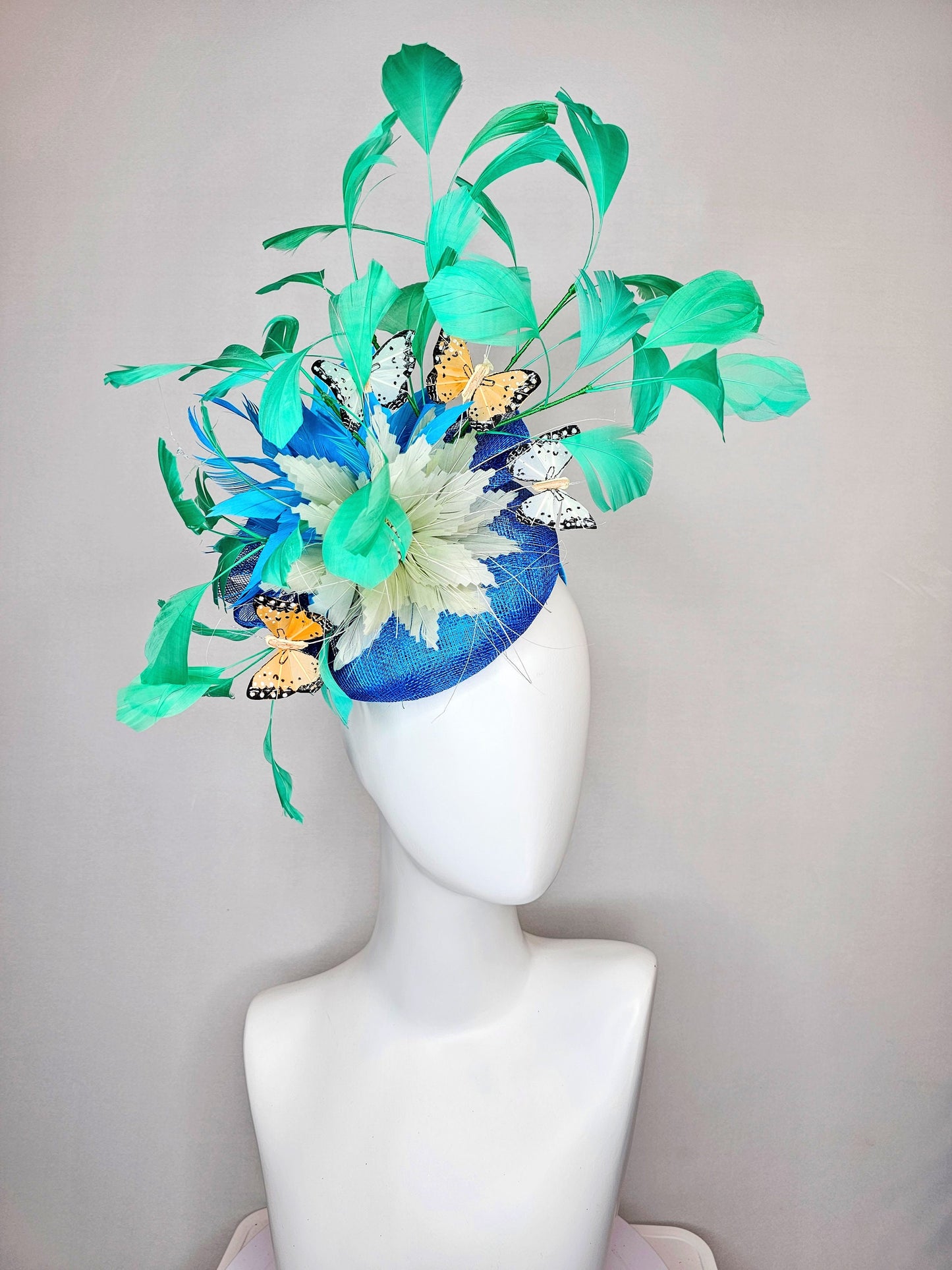 kentucky derby hat fascinator blue turquoise sinamay light green feather flower green feathers and white orange coral black butterflies
