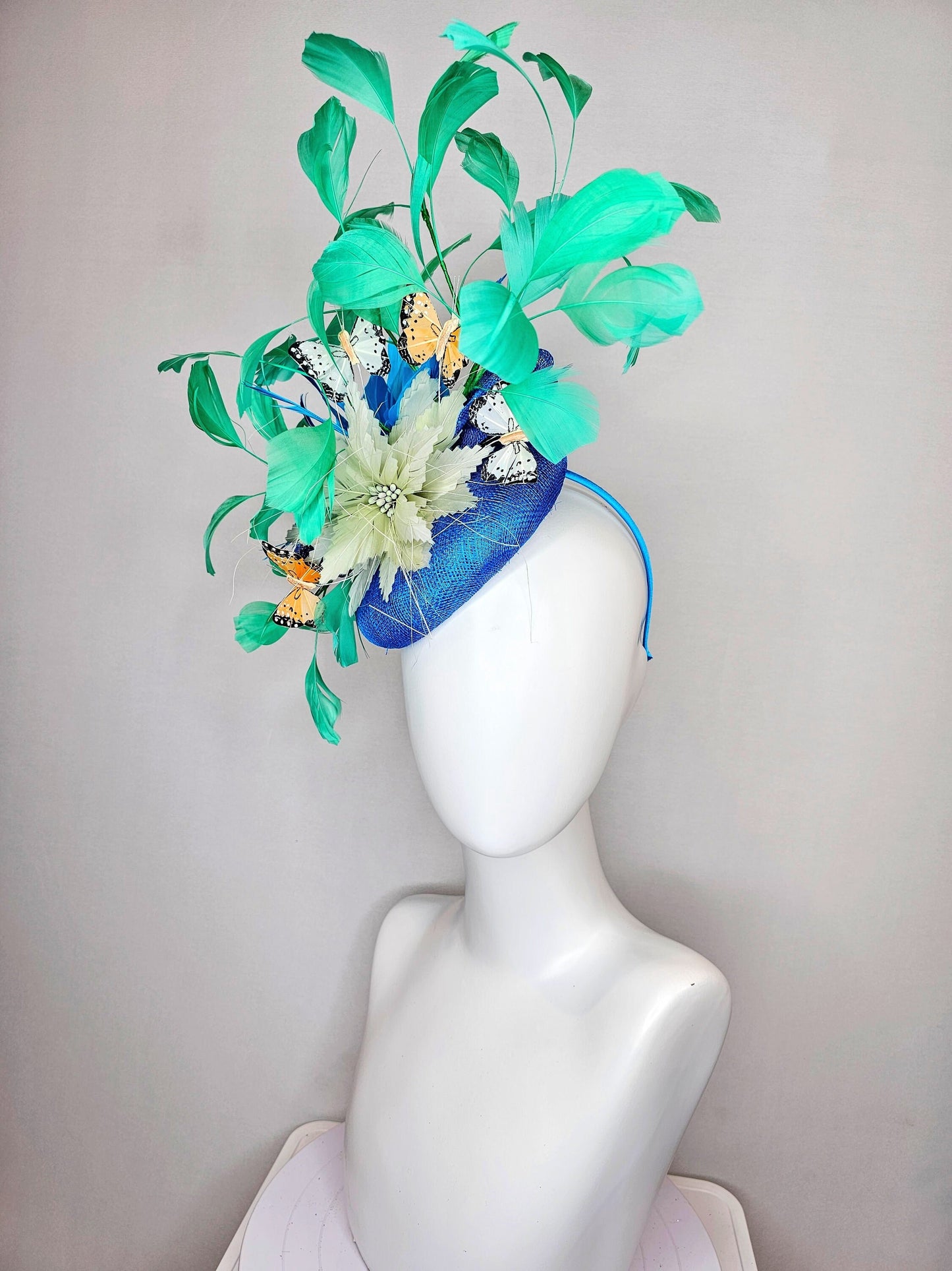kentucky derby hat fascinator blue turquoise sinamay light green feather flower green feathers and white orange coral black butterflies