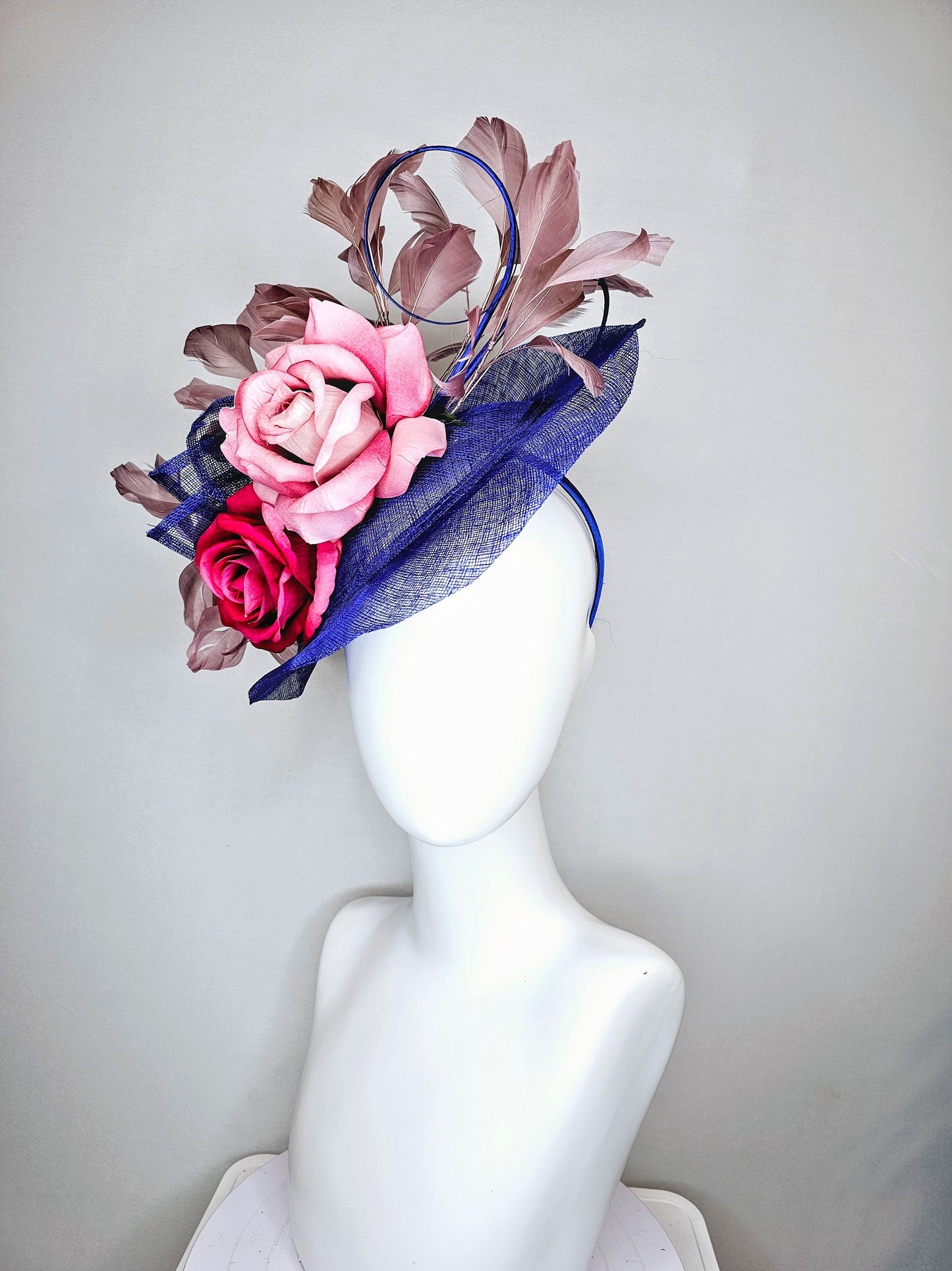 kentucky derby hat fascinator royal blue sinamay with light pink blush and bright dark pink roses with taupe feather decor