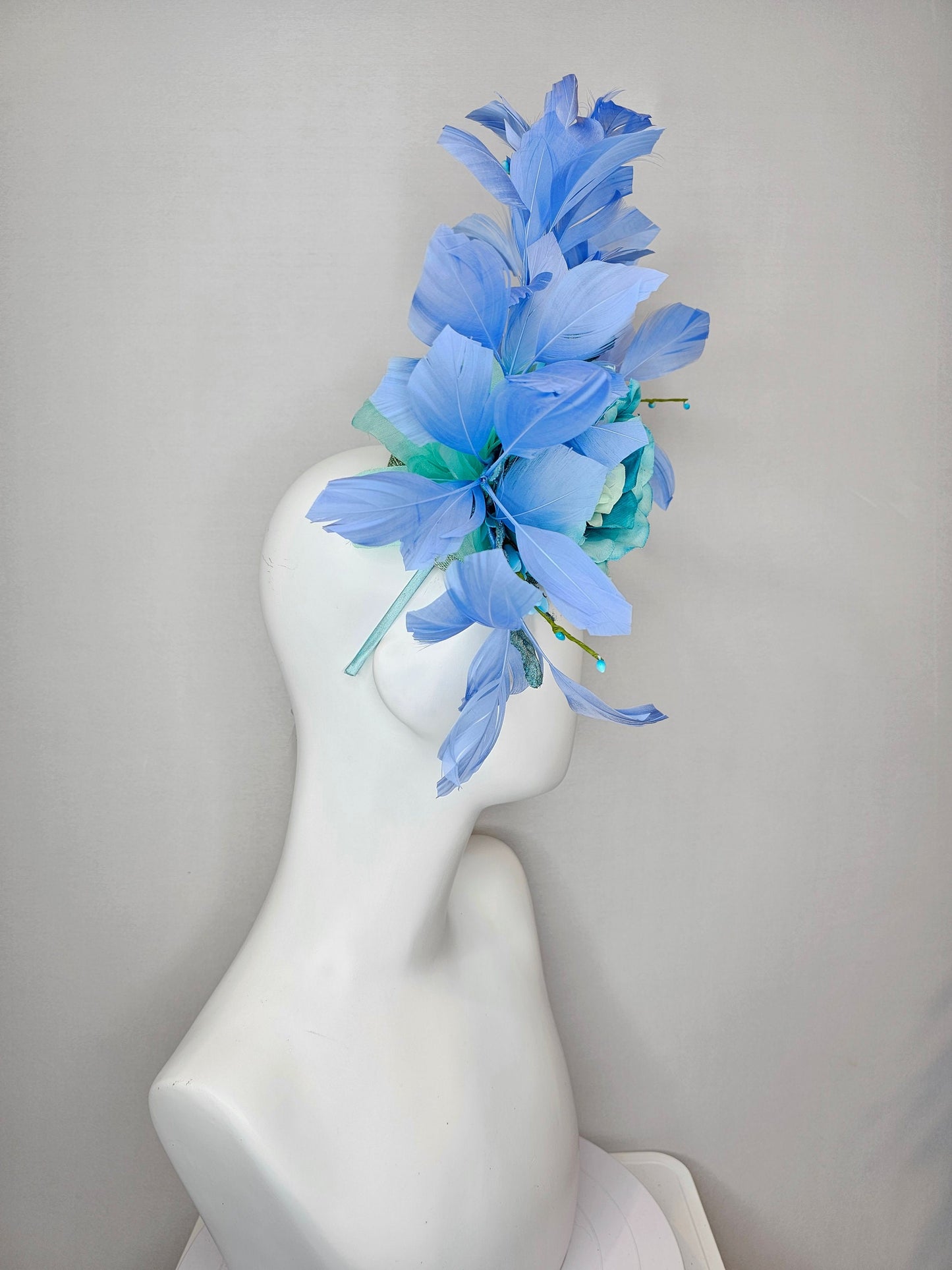 kentucky derby hat fascinator blue teal ombre rose with branching blue feathers and blue velvet leaves