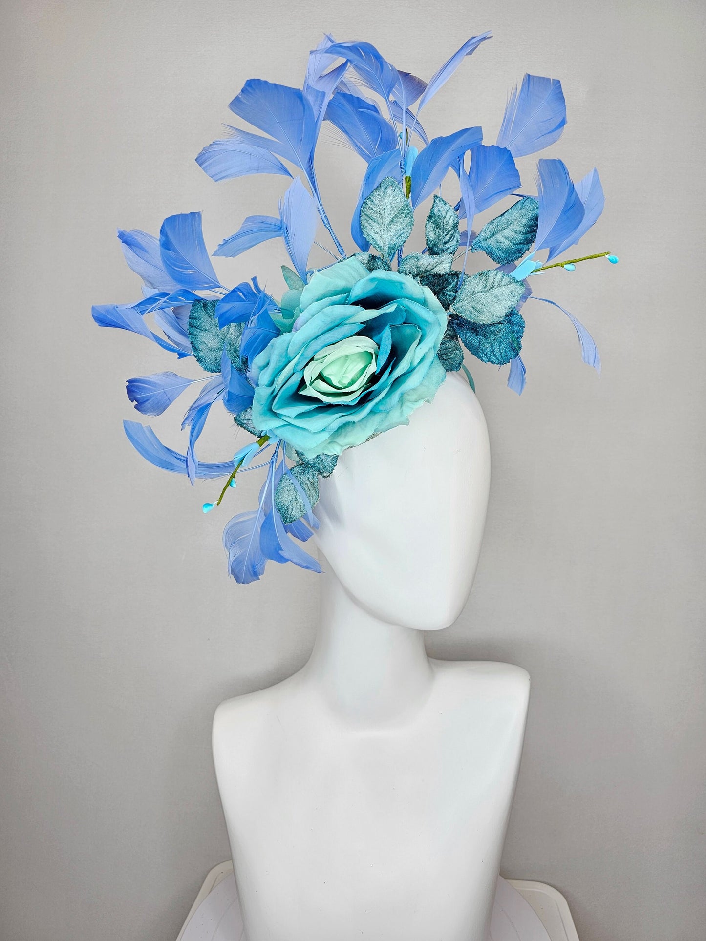 kentucky derby hat fascinator blue teal ombre rose with branching blue feathers and blue velvet leaves