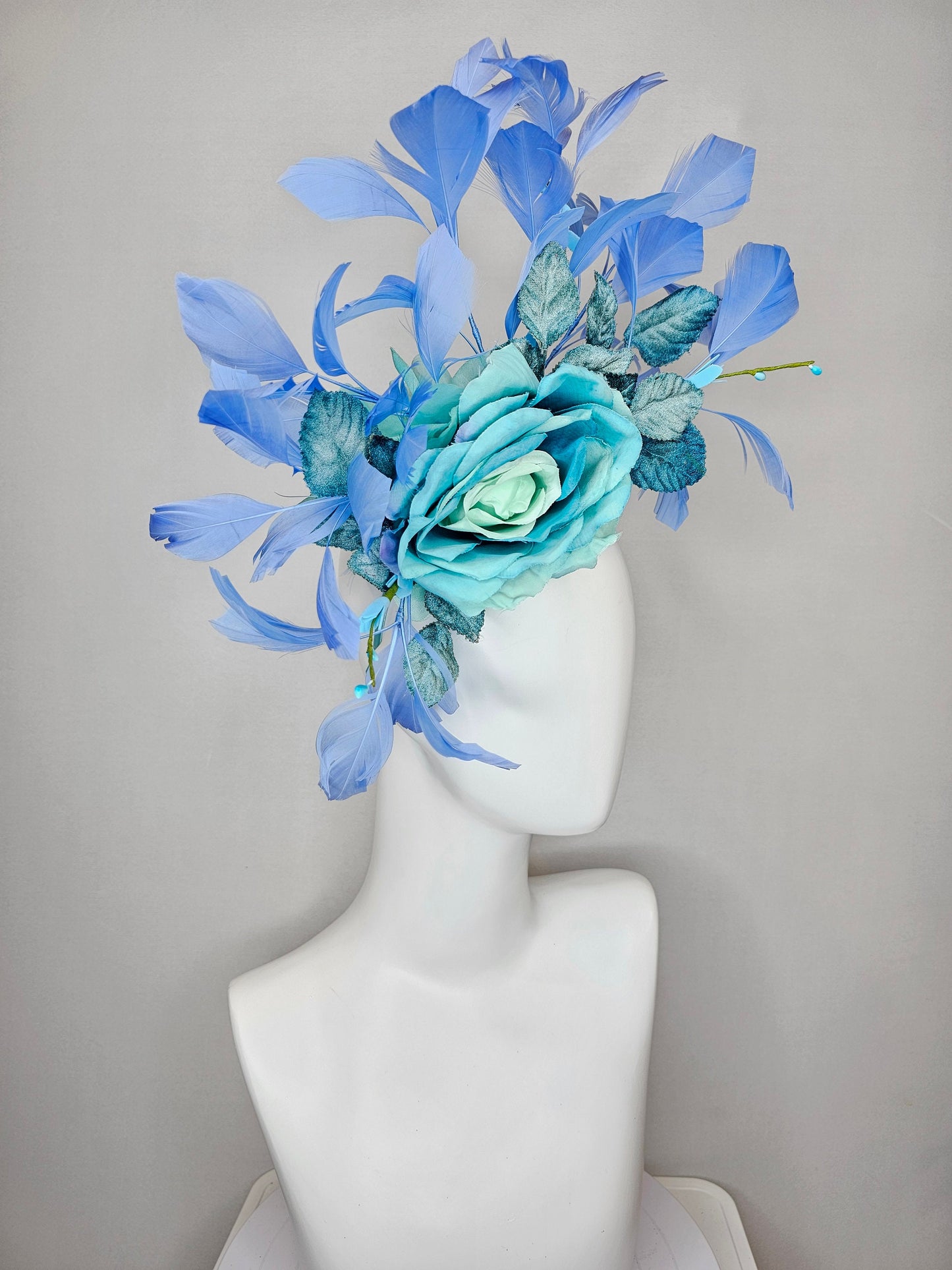 kentucky derby hat fascinator blue teal ombre rose with branching blue feathers and blue velvet leaves