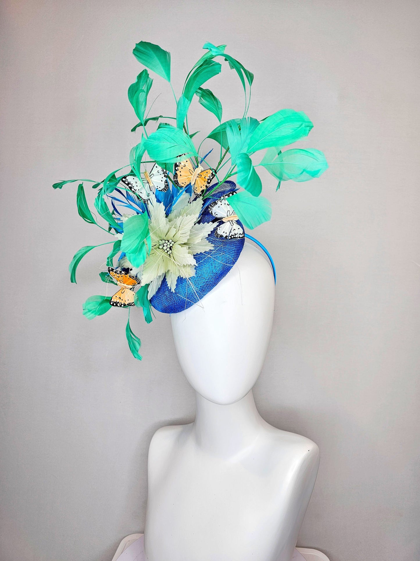 kentucky derby hat fascinator blue turquoise sinamay light green feather flower green feathers and white orange coral black butterflies