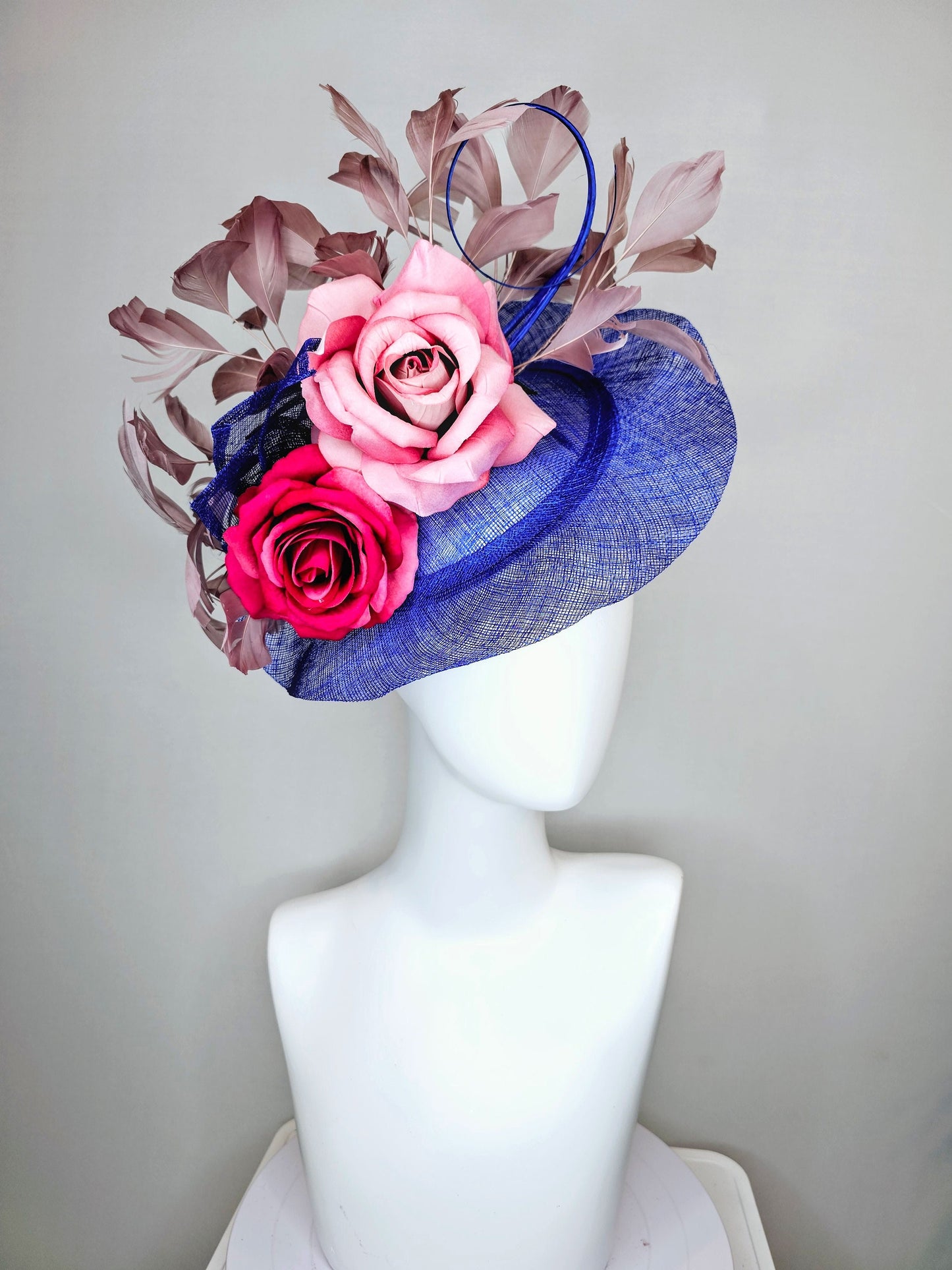 kentucky derby hat fascinator royal blue sinamay with light pink blush and bright dark pink roses with taupe feather decor
