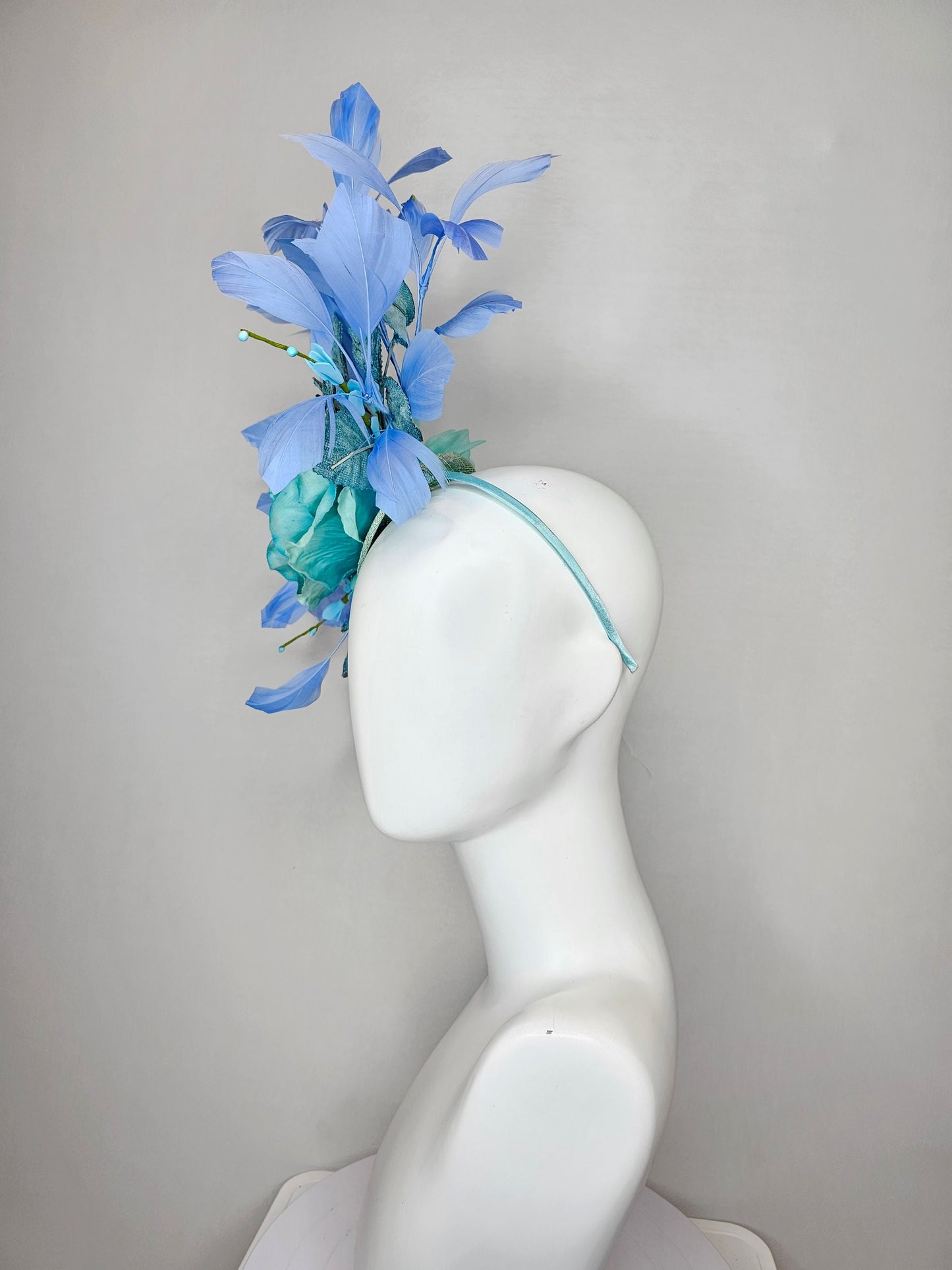 kentucky derby hat fascinator blue teal ombre rose with branching blue feathers and blue velvet leaves