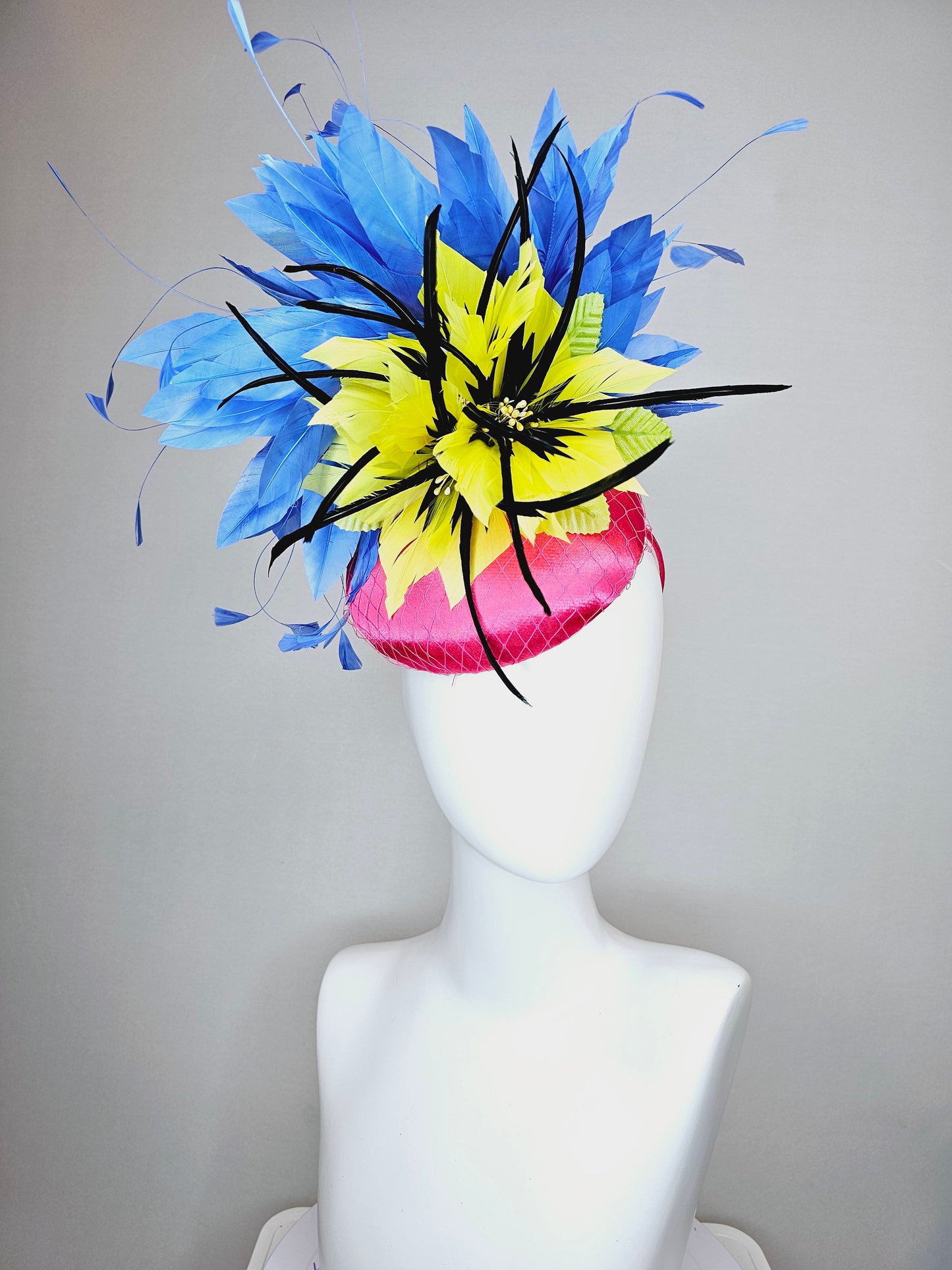 kentucky derby hat fascinator bright pink fuchsia satin with yellow and black feather flowers and periwinkle blue feathers