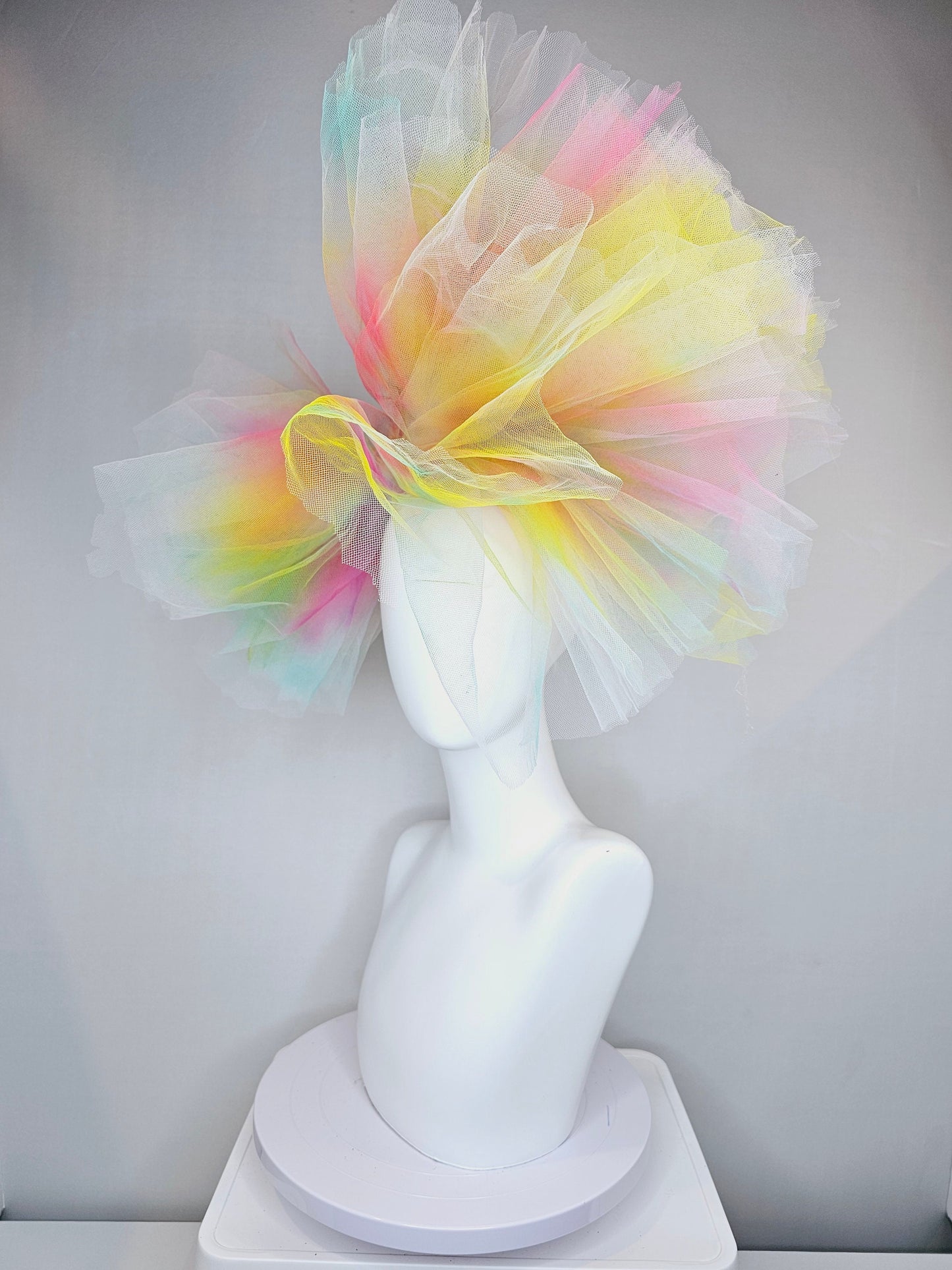 kentucky derby hat fascinator very large netting colorful distressed tulle rainbow sheer asymmetric bow on headband