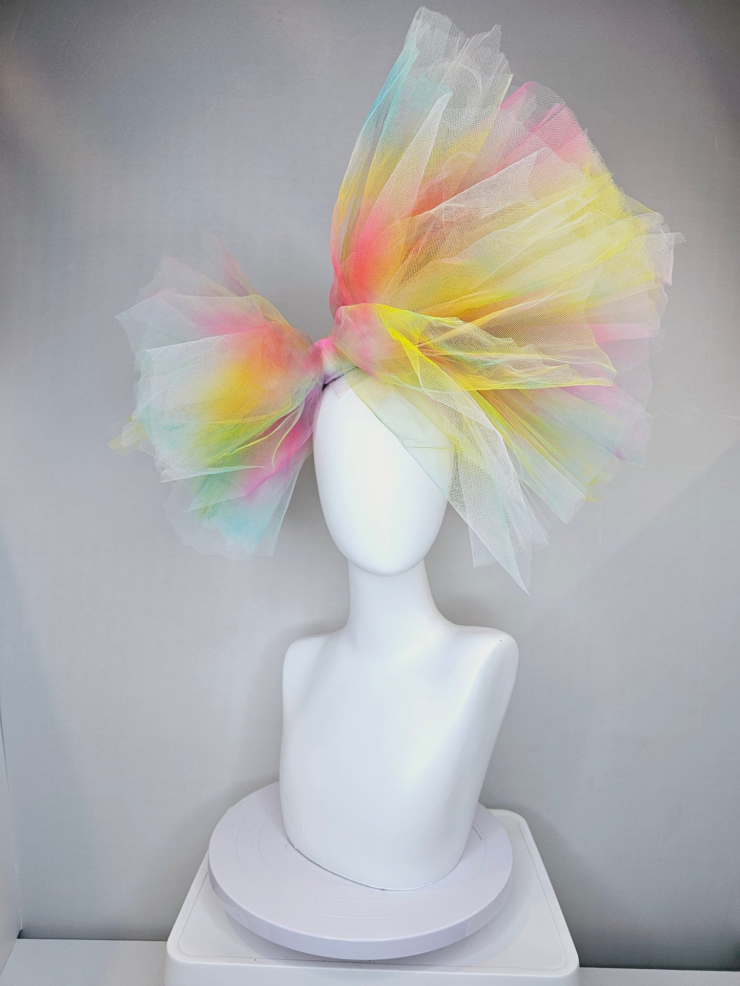 kentucky derby hat fascinator very large netting colorful distressed tulle rainbow sheer asymmetric bow on headband