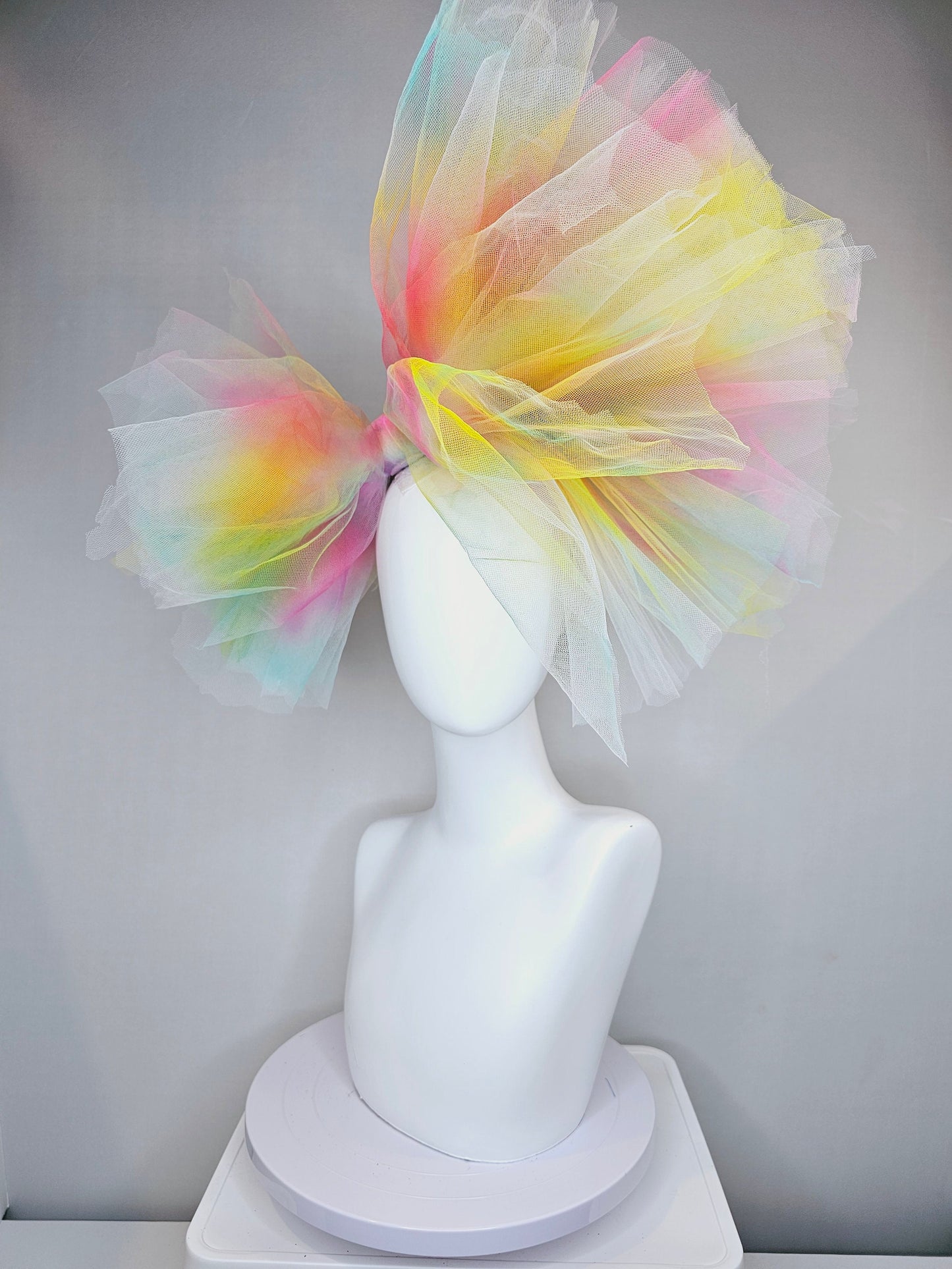 kentucky derby hat fascinator very large netting colorful distressed tulle rainbow sheer asymmetric bow on headband