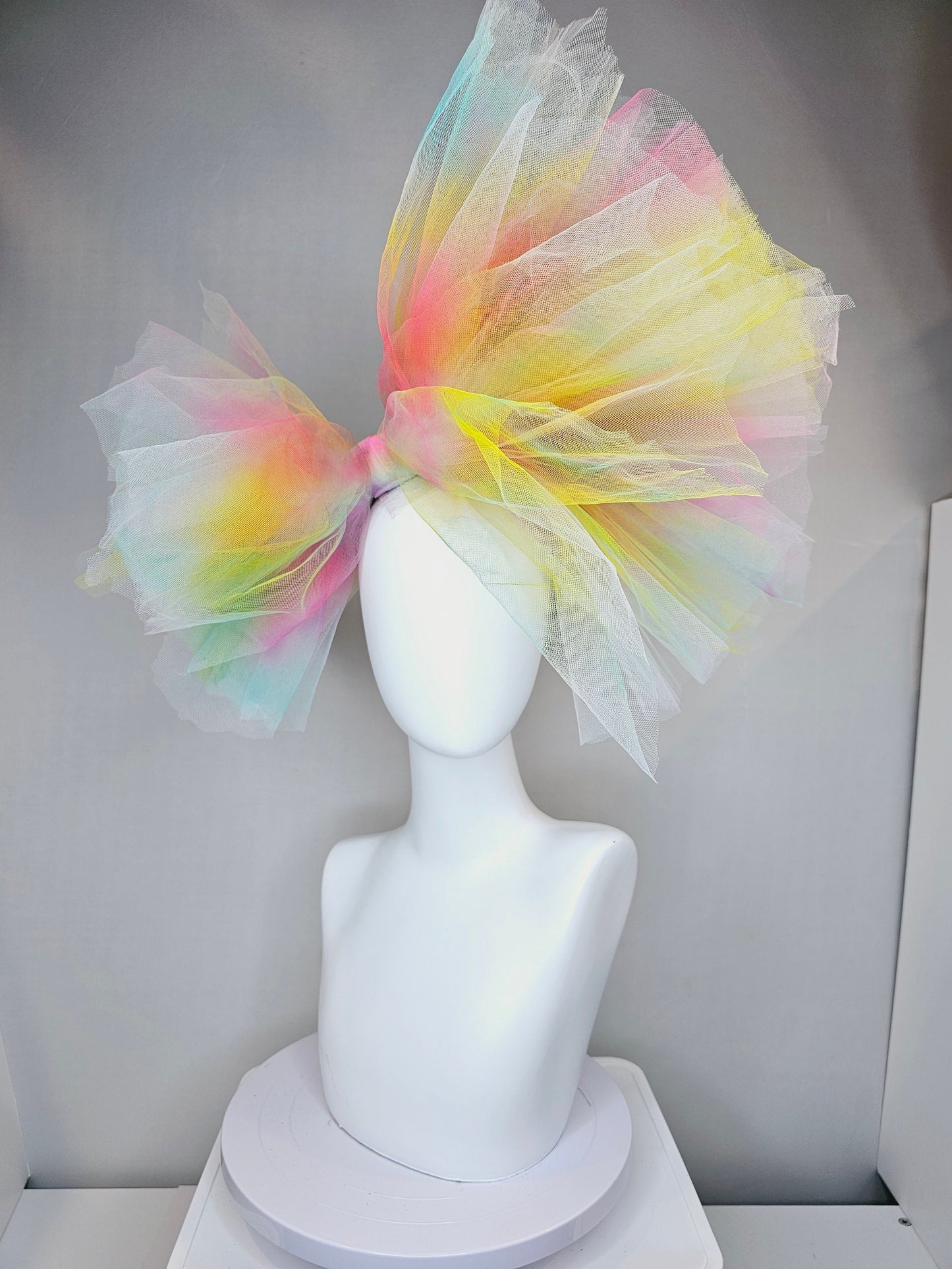 kentucky derby hat fascinator very large netting colorful distressed tulle rainbow sheer asymmetric bow on headband