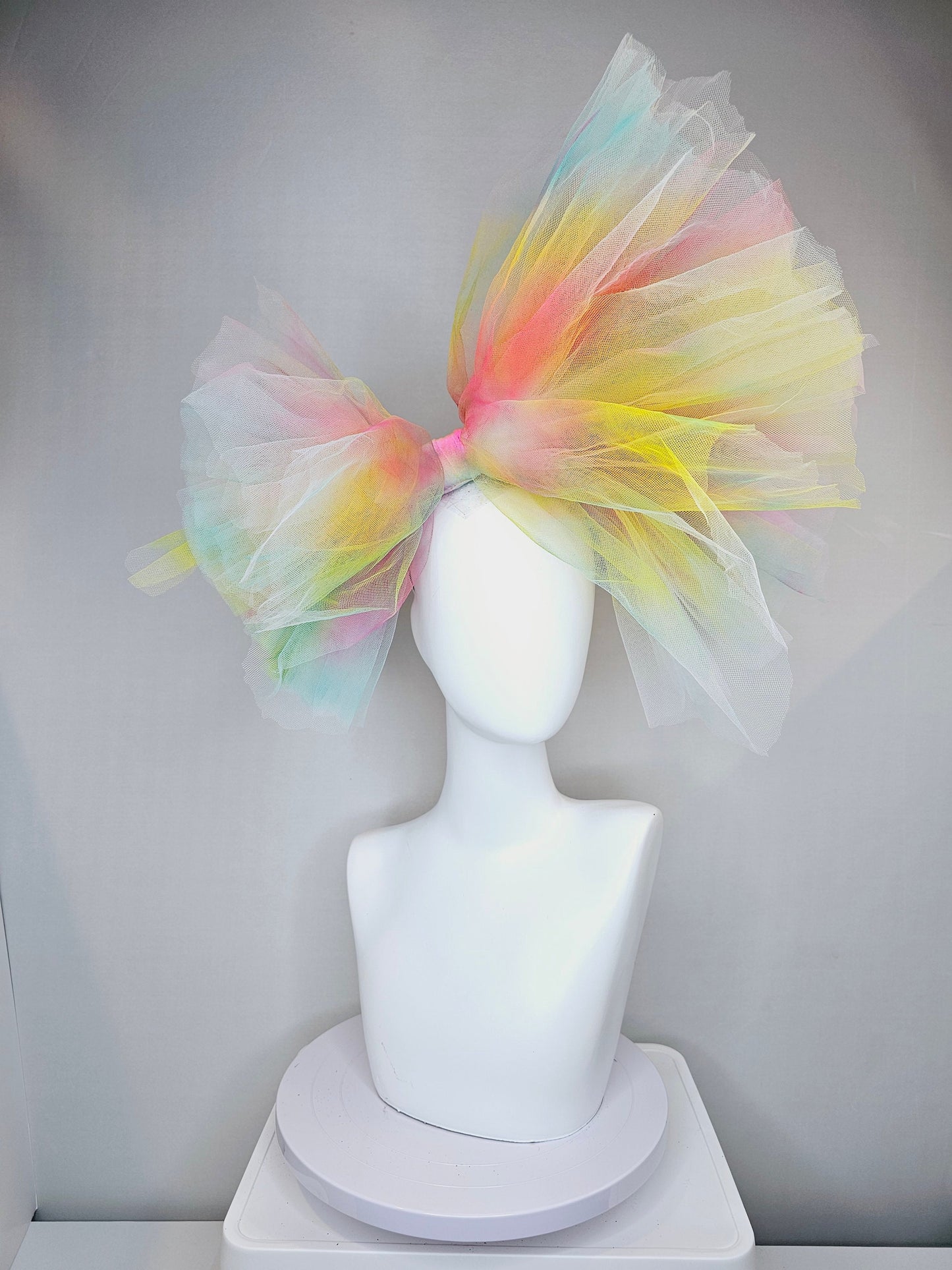 kentucky derby hat fascinator very large netting colorful distressed tulle rainbow sheer asymmetric bow on headband