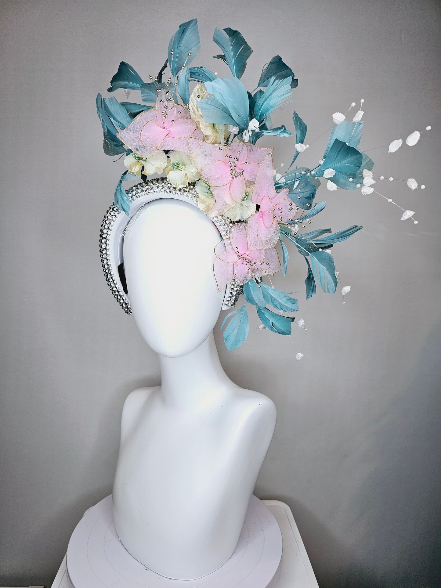 kentucky derby hat fascinator silver swarovski crystal headband with light peacock green blue feathers with pink wired flowers and pearls
