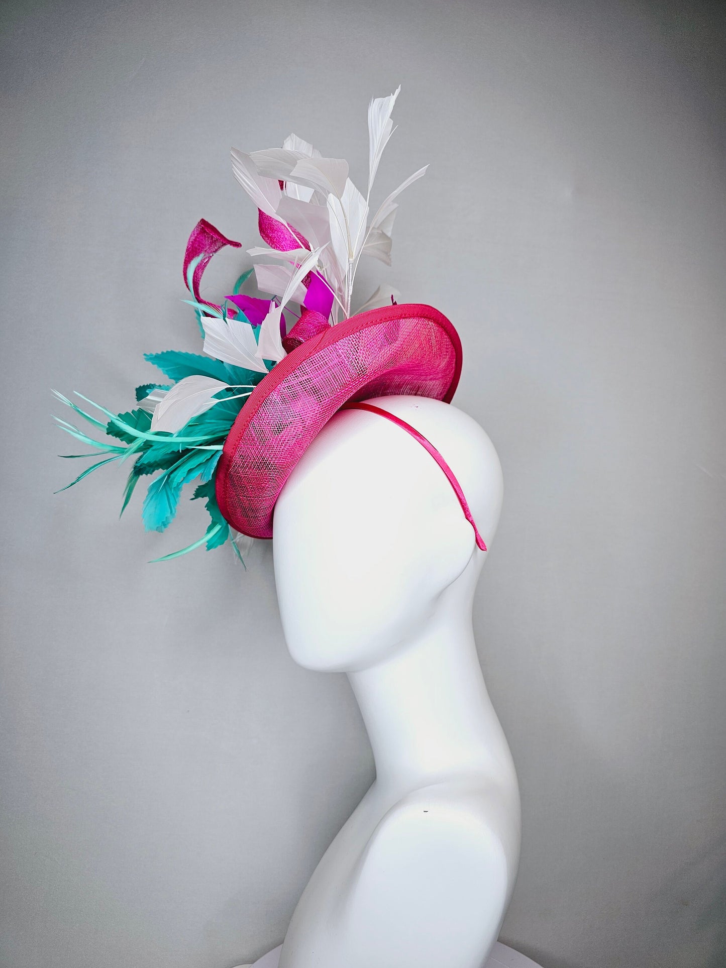 kentucky derby hat fascinator hot pink sinamay saucer with curls white feathers and green feather flower
