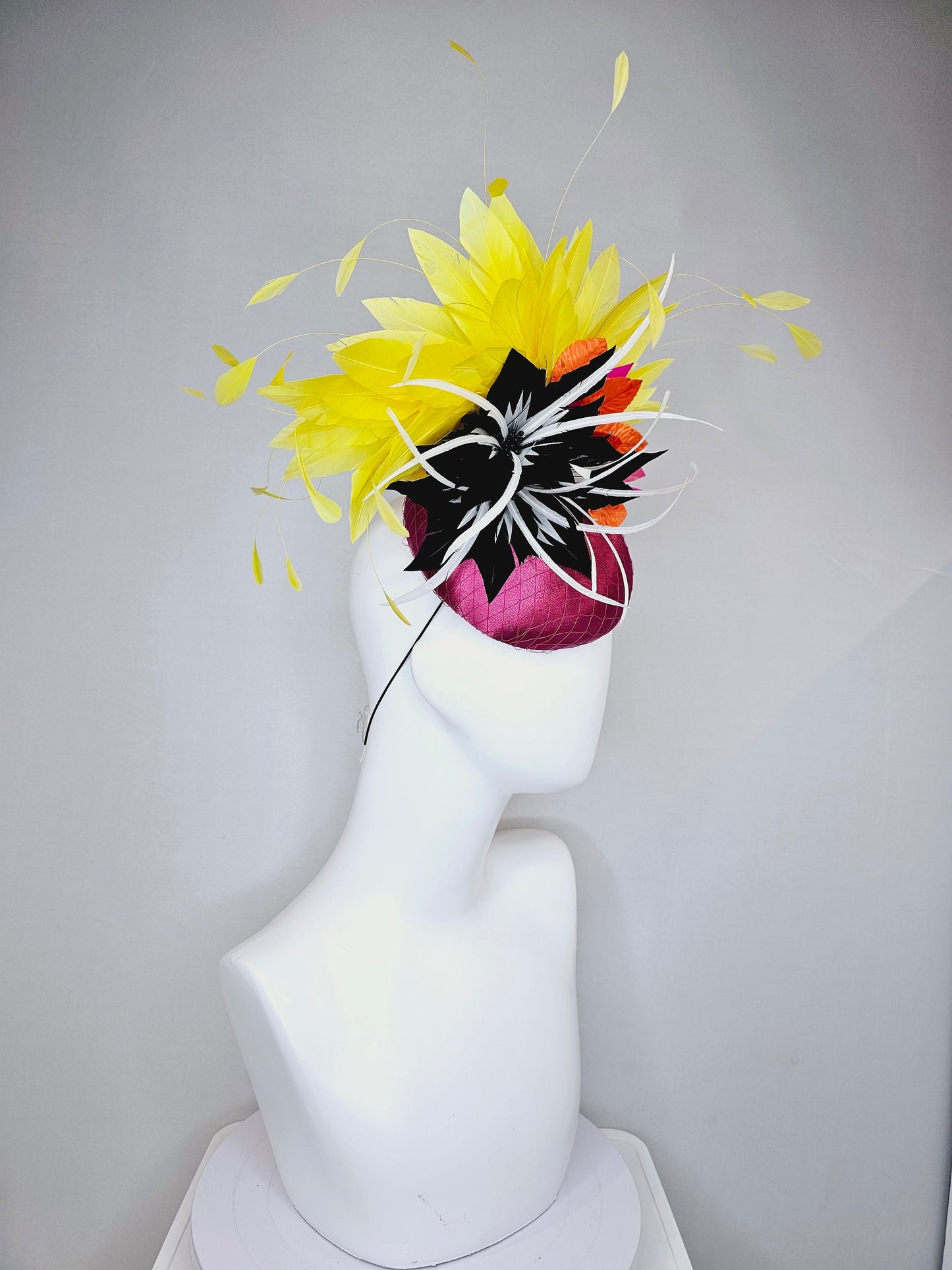 kentucky derby hat fascinator magenta purple pink satin fascinator with black feather flower coral orange leaves and yellow feathers