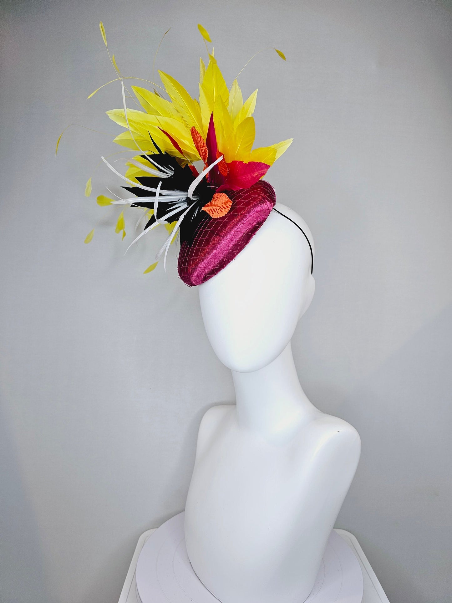 kentucky derby hat fascinator magenta purple pink satin fascinator with black feather flower coral orange leaves and yellow feathers