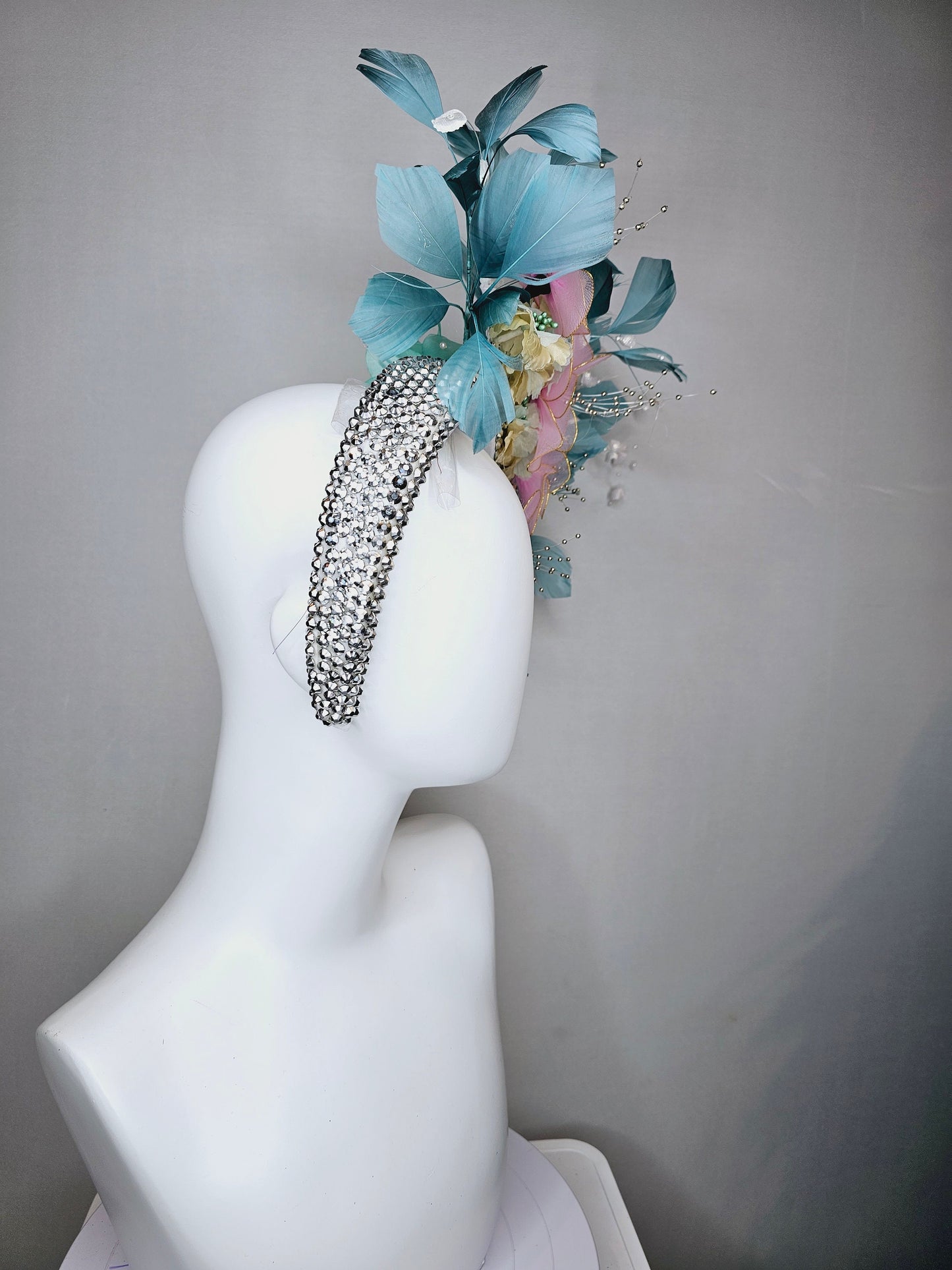 kentucky derby hat fascinator silver swarovski crystal headband with light peacock green blue feathers with pink wired flowers and pearls