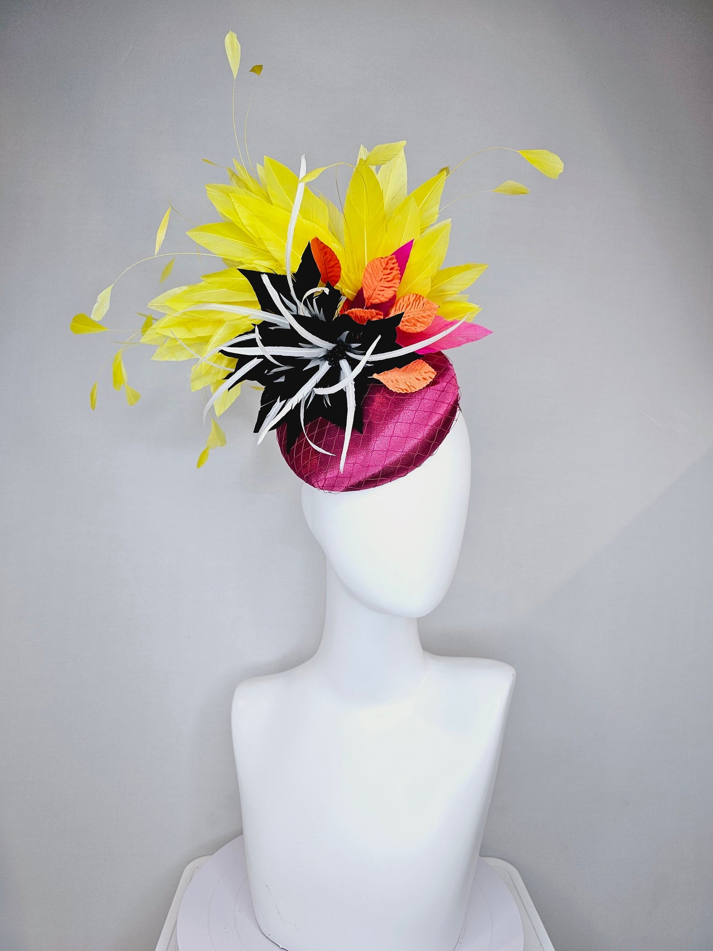 kentucky derby hat fascinator magenta purple pink satin fascinator with black feather flower coral orange leaves and yellow feathers
