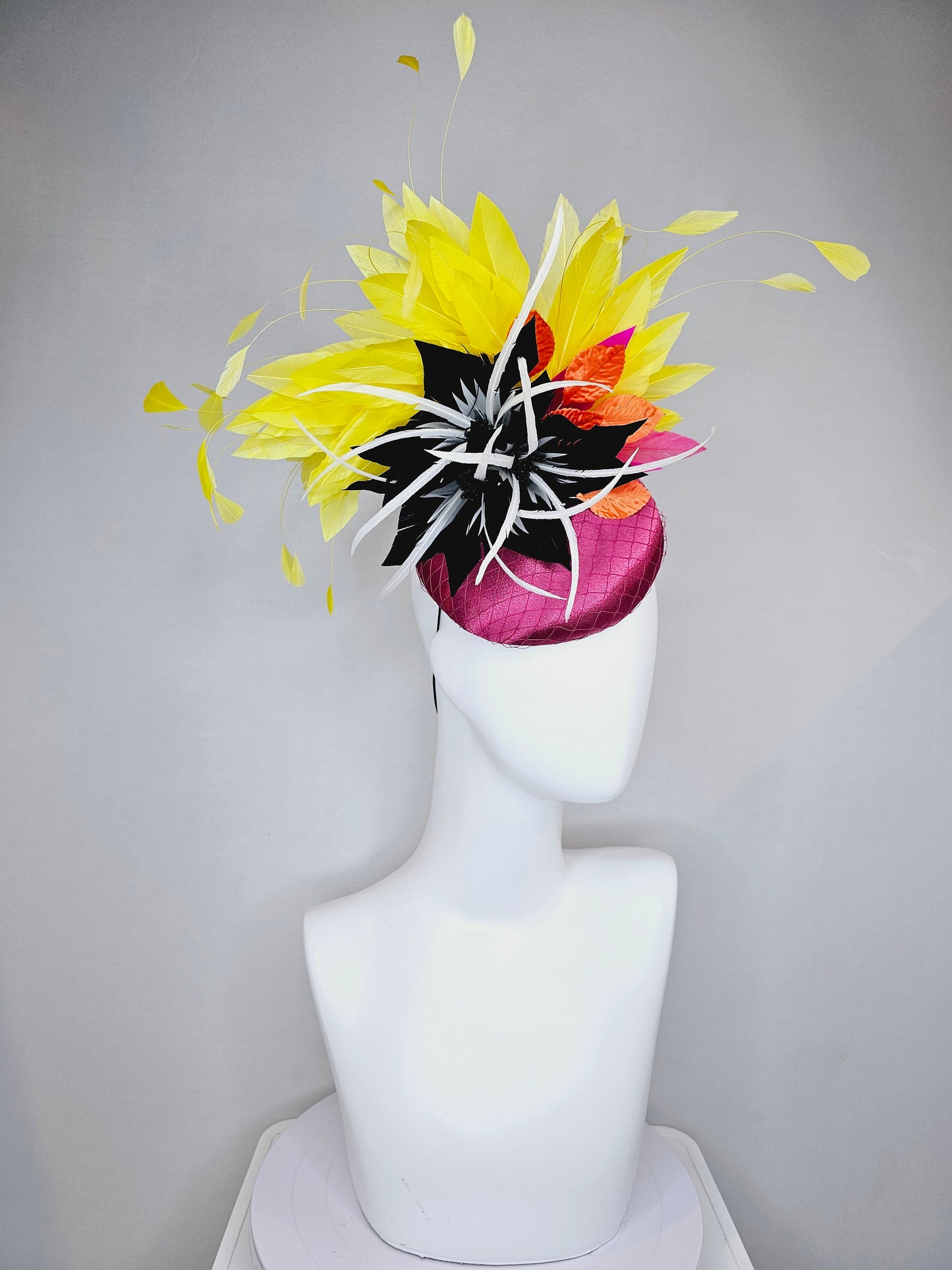 kentucky derby hat fascinator magenta purple pink satin fascinator with black feather flower coral orange leaves and yellow feathers