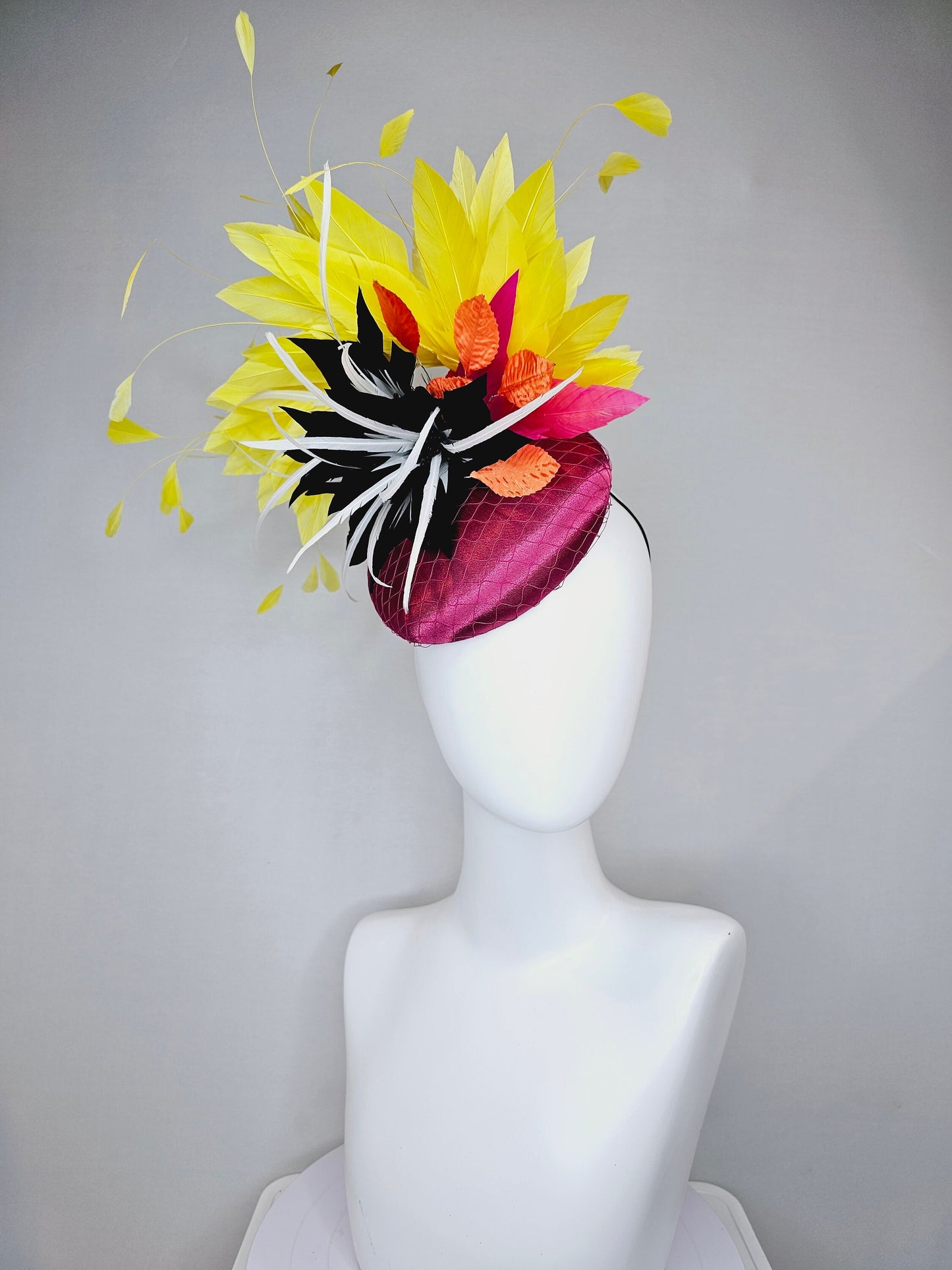 kentucky derby hat fascinator magenta purple pink satin fascinator with black feather flower coral orange leaves and yellow feathers