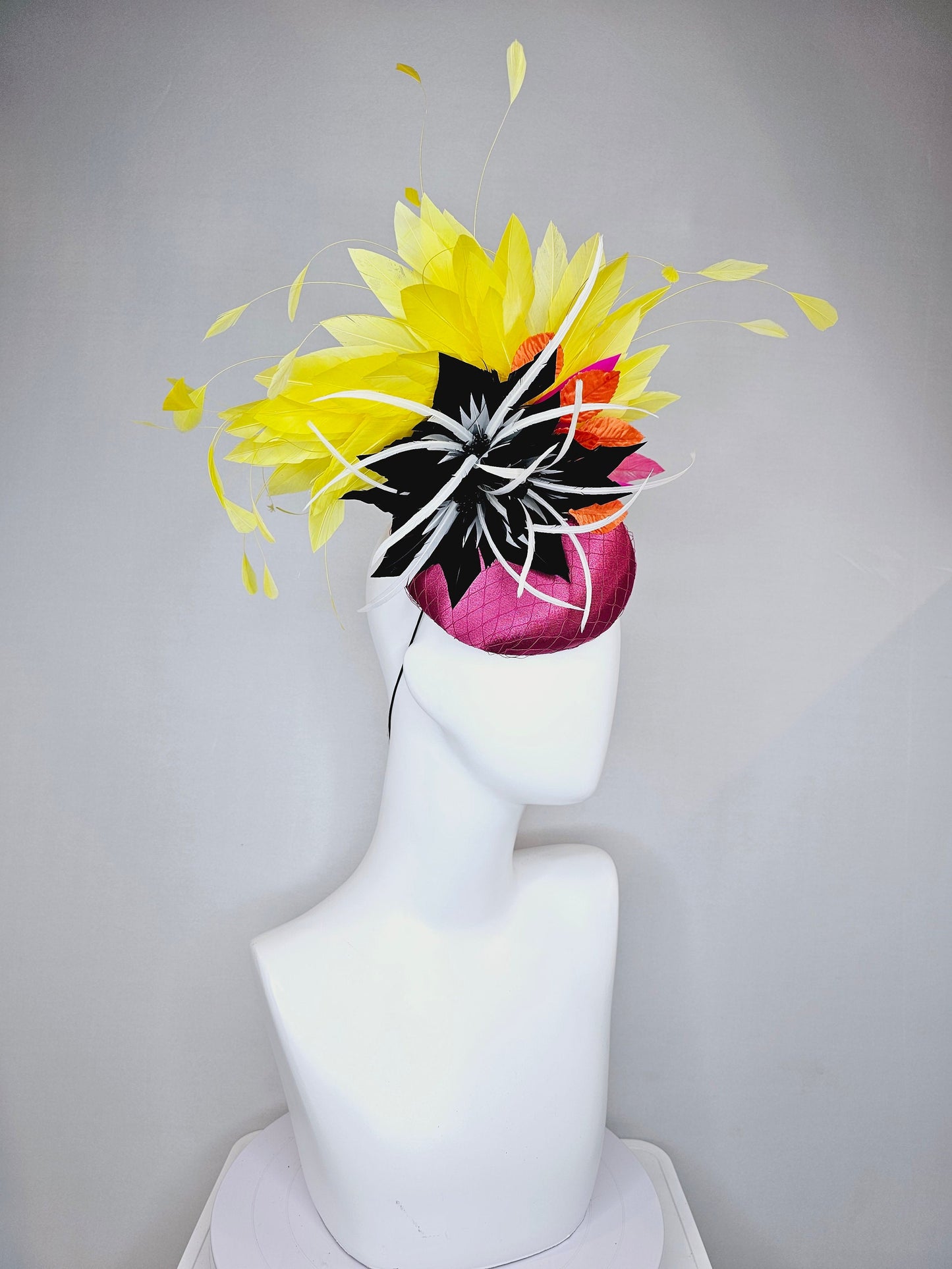kentucky derby hat fascinator magenta purple pink satin fascinator with black feather flower coral orange leaves and yellow feathers