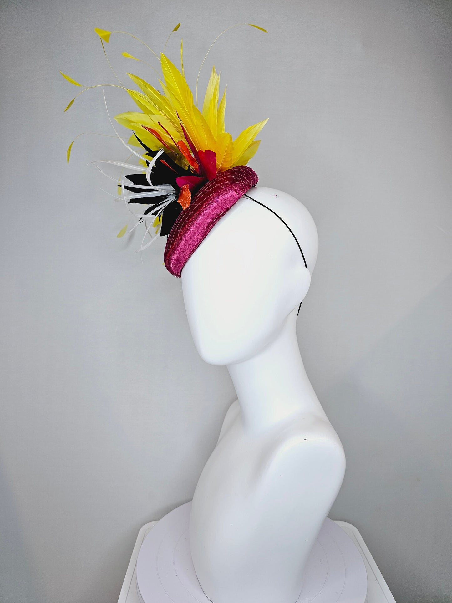 kentucky derby hat fascinator magenta purple pink satin fascinator with black feather flower coral orange leaves and yellow feathers