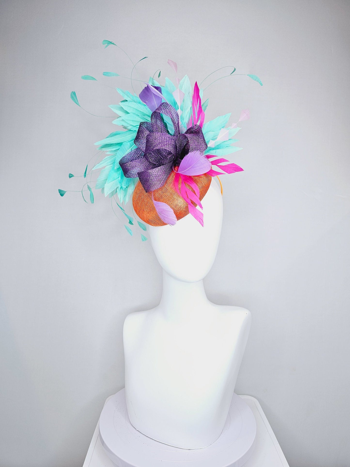 kentucky derby hat fascinator orange sinamay with mint green feathers with purple sinamay bow and hot pink feather accent