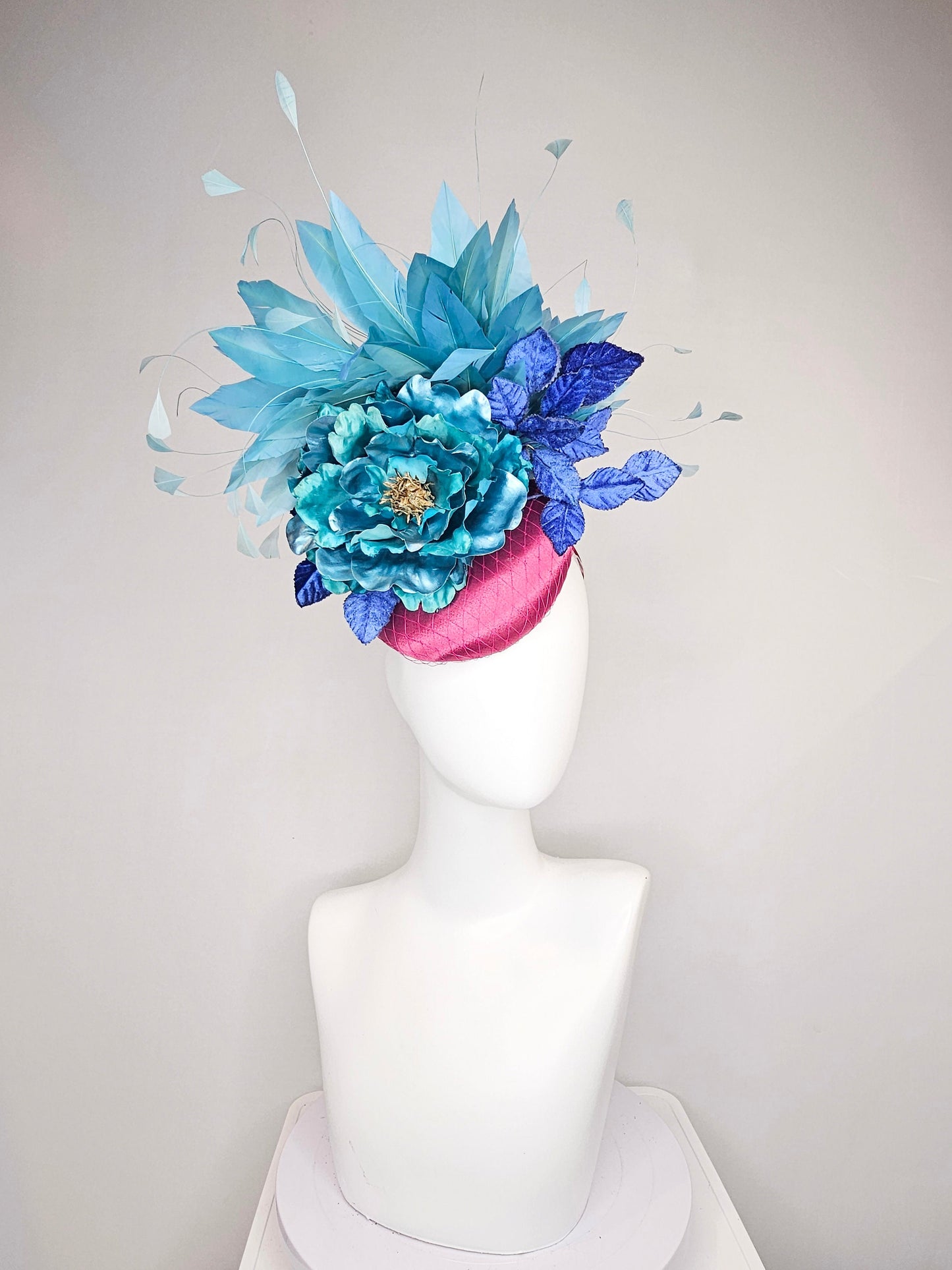 kentucky derby hat fascinator fuchsia magenta satin teal metallic blue green flower royal blue leaves peacock teal blue green feathers