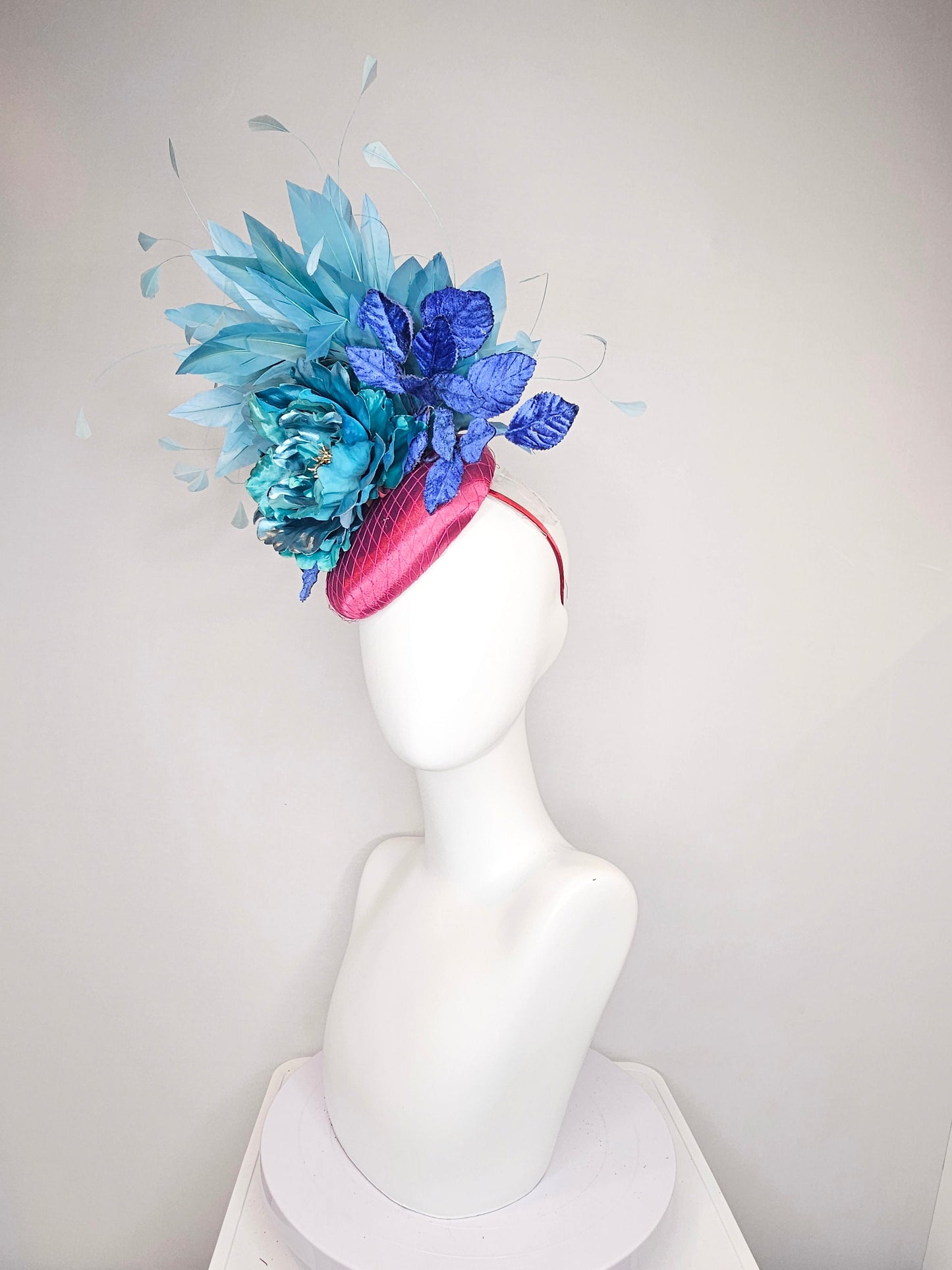 kentucky derby hat fascinator fuchsia magenta satin teal metallic blue green flower royal blue leaves peacock teal blue green feathers
