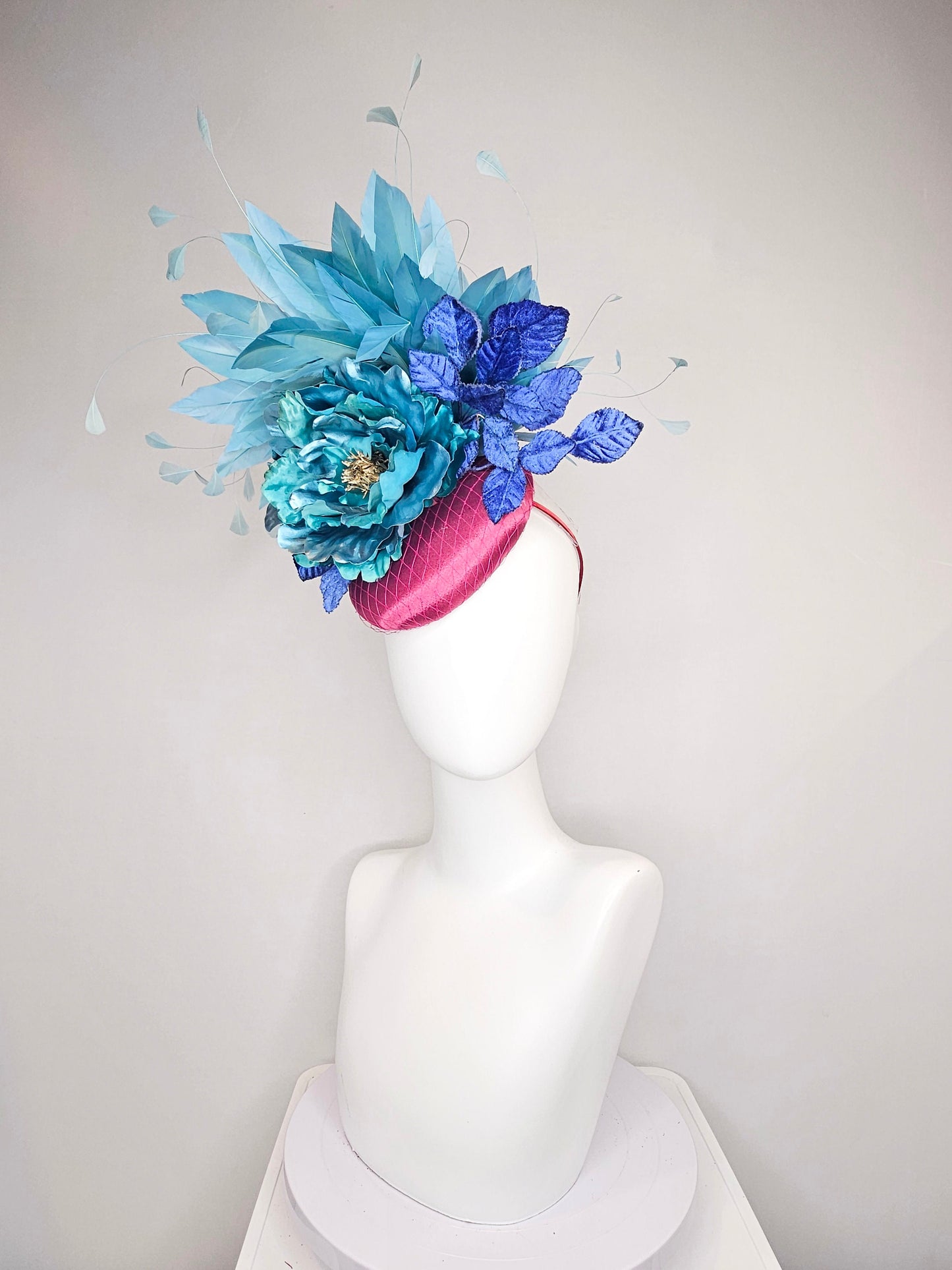 kentucky derby hat fascinator fuchsia magenta satin teal metallic blue green flower royal blue leaves peacock teal blue green feathers