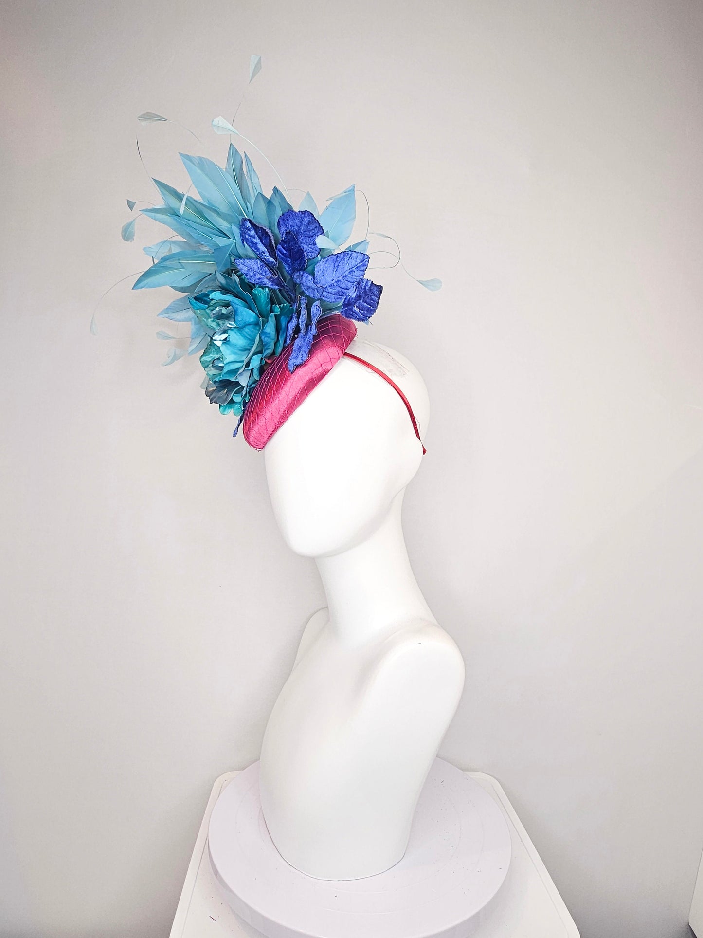kentucky derby hat fascinator fuchsia magenta satin teal metallic blue green flower royal blue leaves peacock teal blue green feathers
