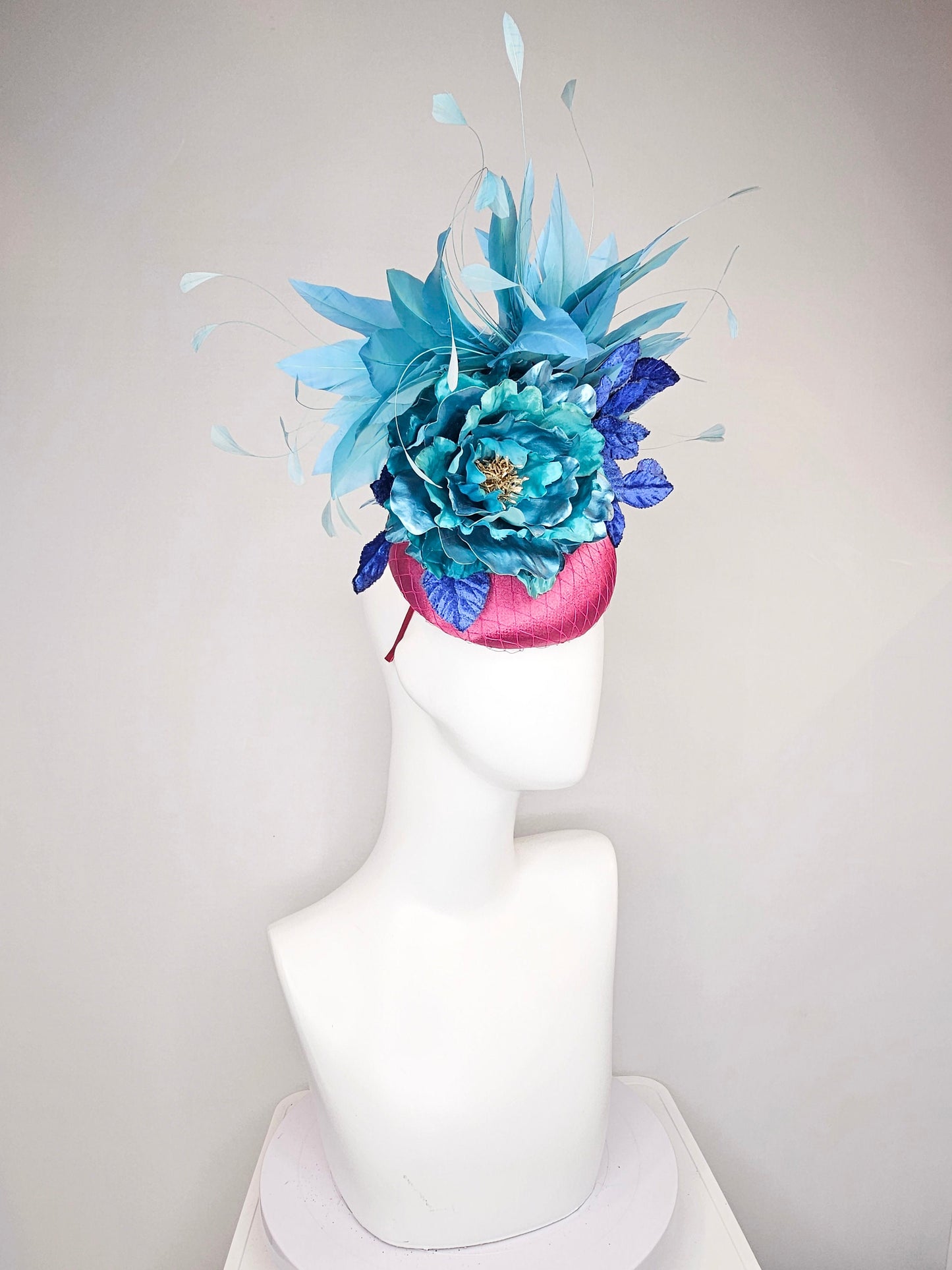 kentucky derby hat fascinator fuchsia magenta satin teal metallic blue green flower royal blue leaves peacock teal blue green feathers