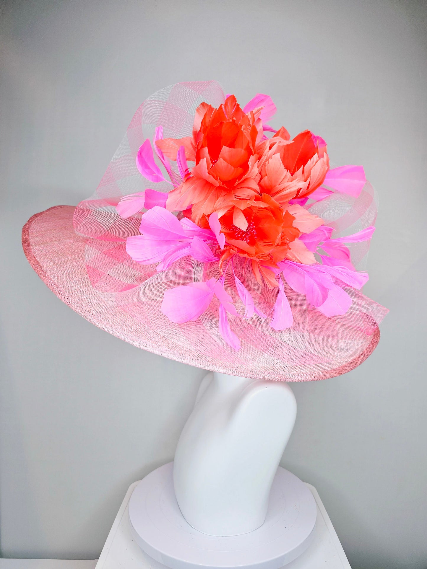 kentucky derby hat large wide brim sinamay light pink hat with large pink feather orange coral feather flowers and crinoline