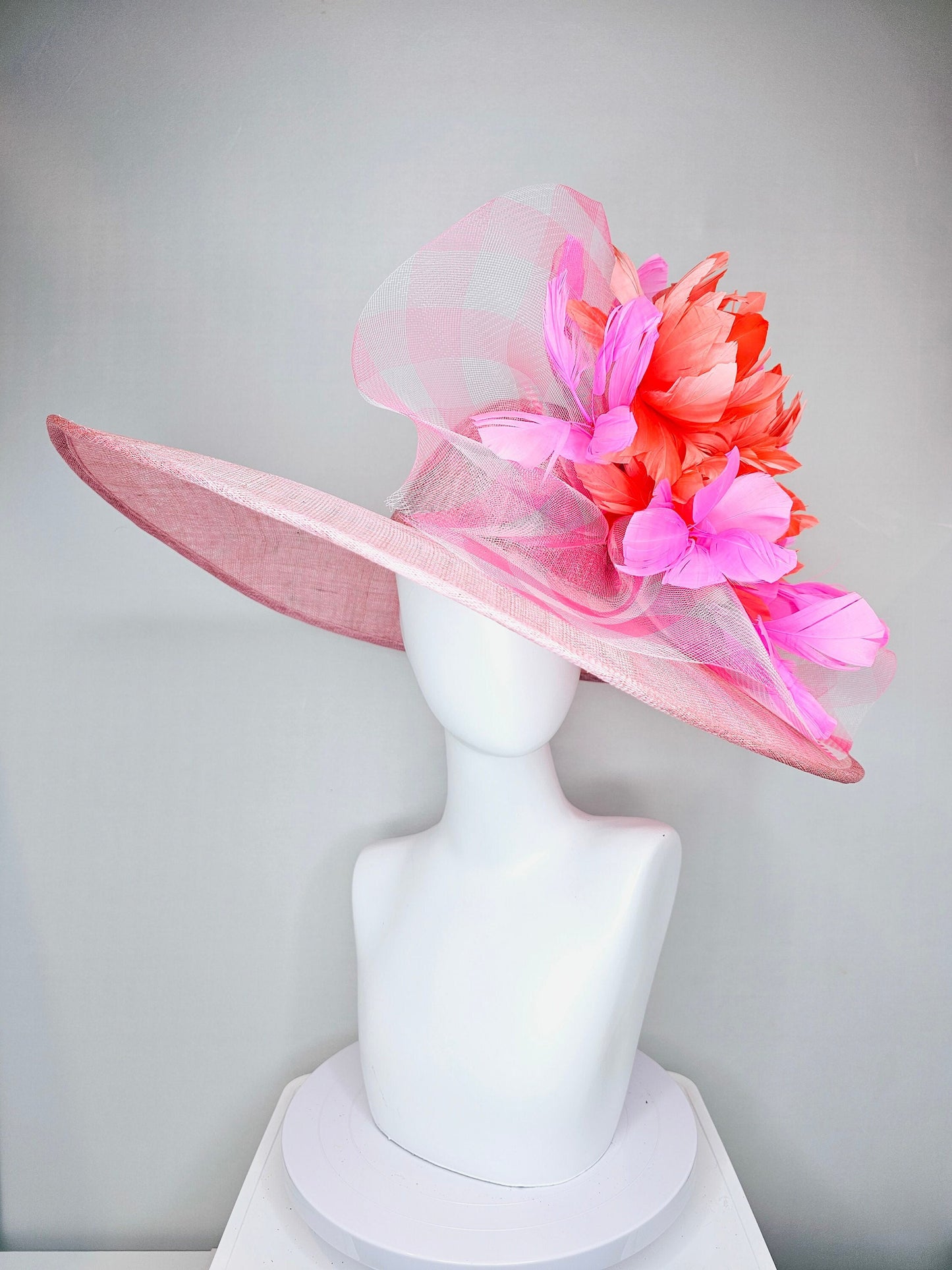 kentucky derby hat large wide brim sinamay light pink hat with large pink feather orange coral feather flowers and crinoline