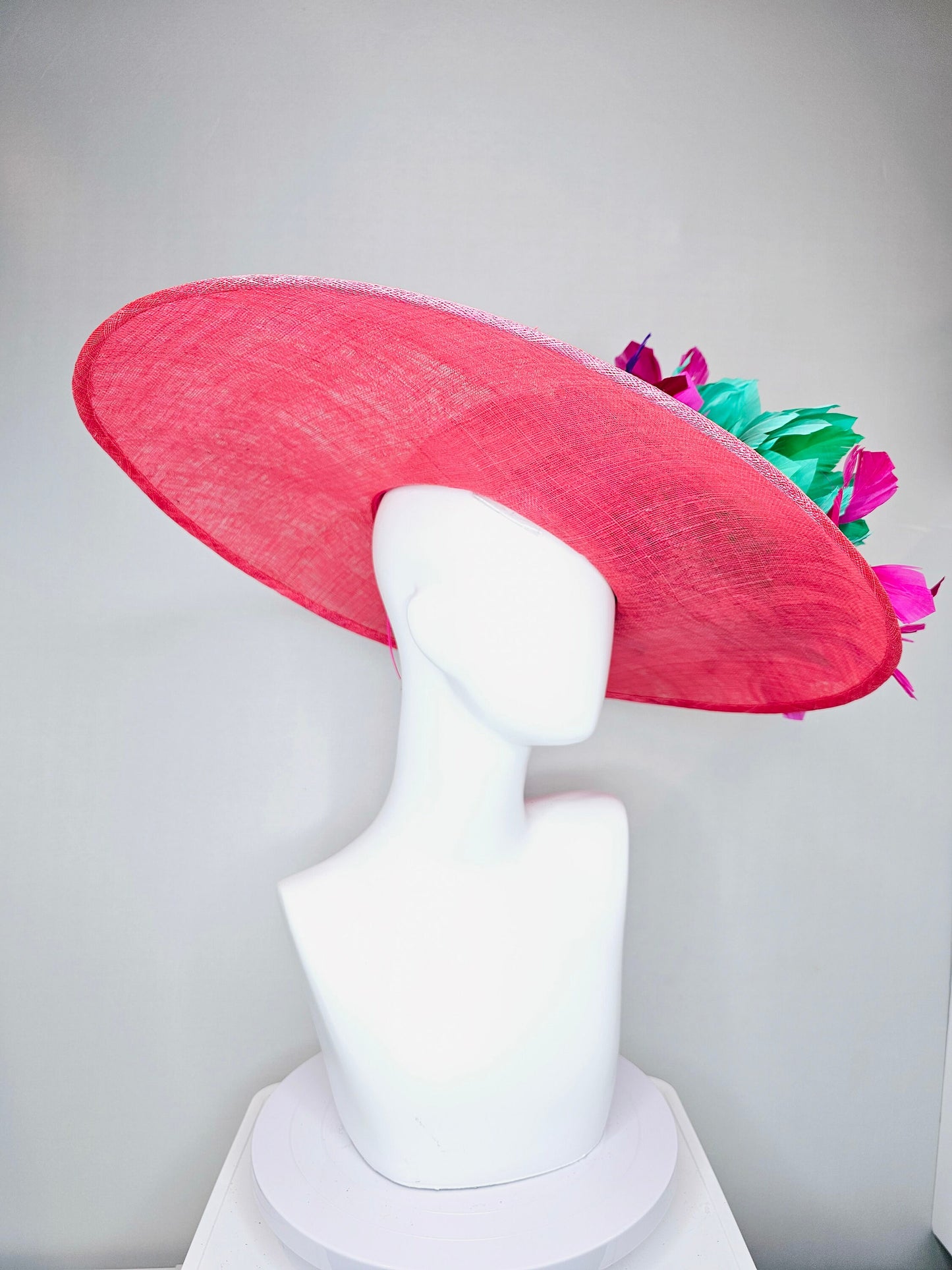 kentucky derby hat large wide brim sinamay coral pink hat with fuchsia bright pink feathers green fluffy feather flowers