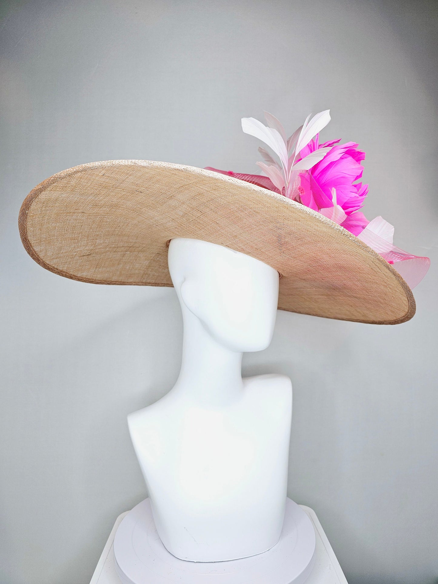 kentucky derby hat large wide brim sinamay neutral taupe beige hat with large white feathers bright pink feather flowers