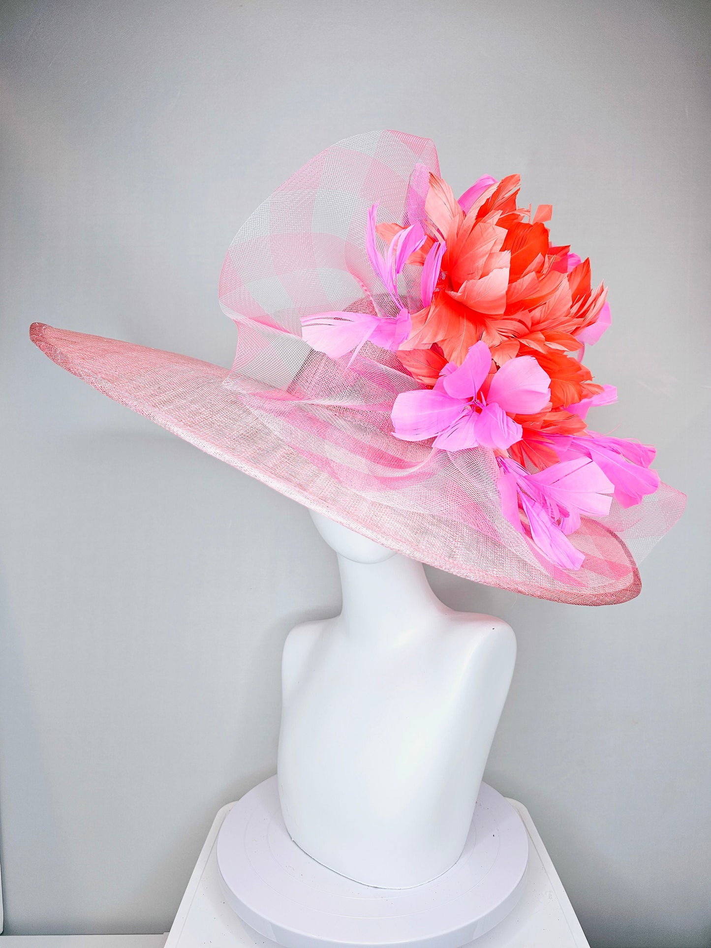 kentucky derby hat large wide brim sinamay light pink hat with large pink feather orange coral feather flowers and crinoline
