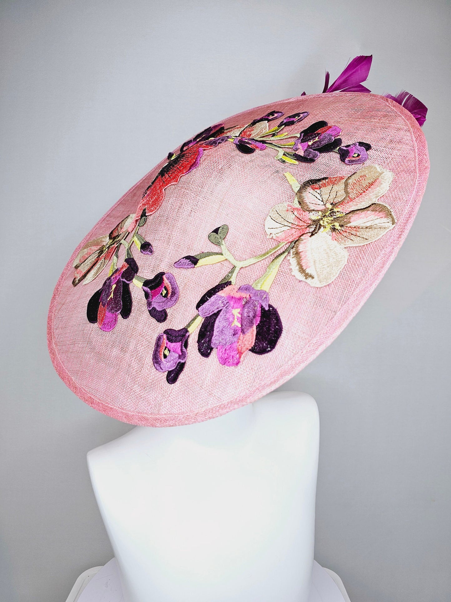 kentucky derby hat fascinator light pink coral sinamay saucer with lavender purple coral yellow embroidered flowers purple coral feathers
