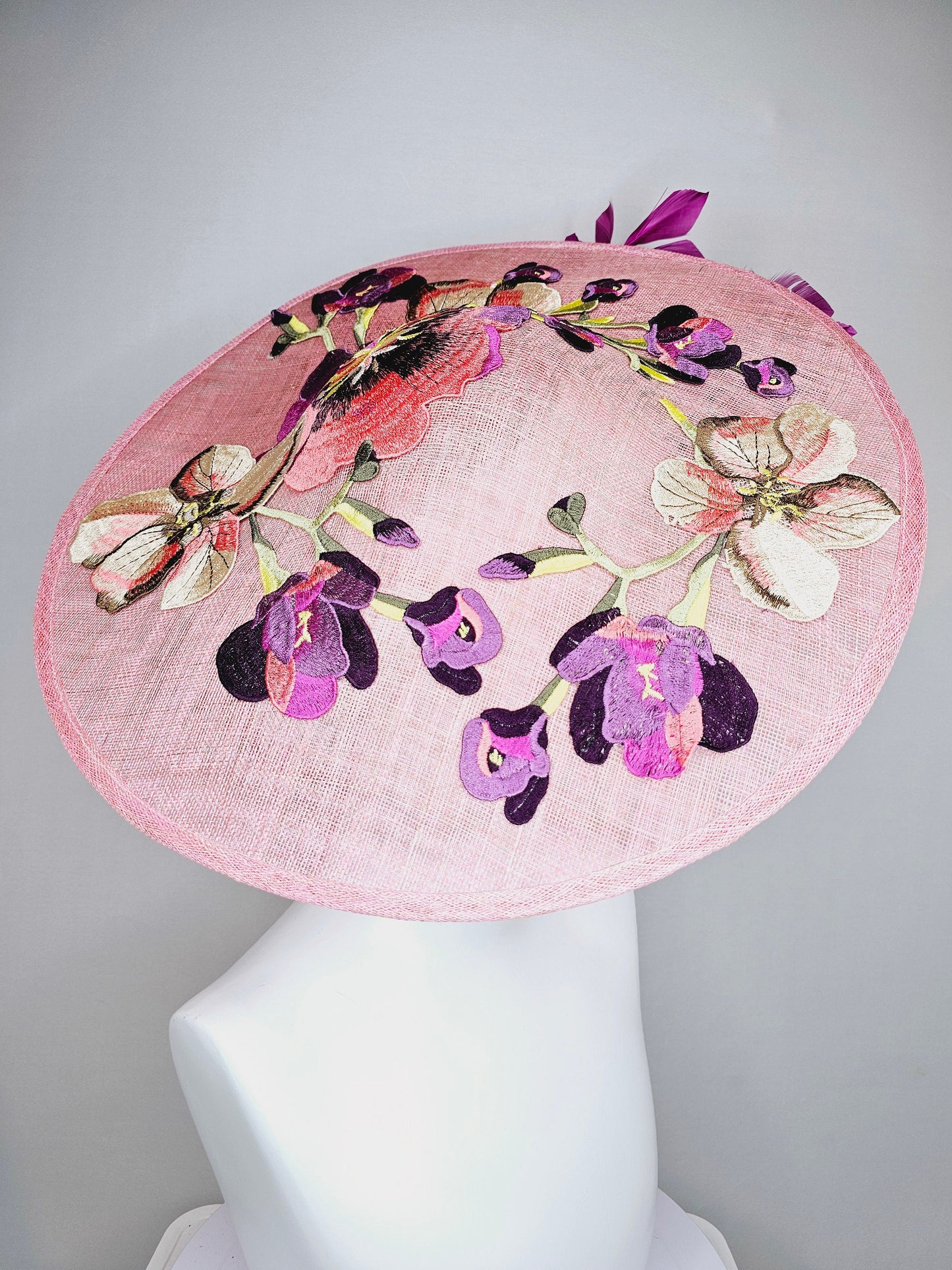 kentucky derby hat fascinator light pink coral sinamay saucer with lavender purple coral yellow embroidered flowers purple coral feathers
