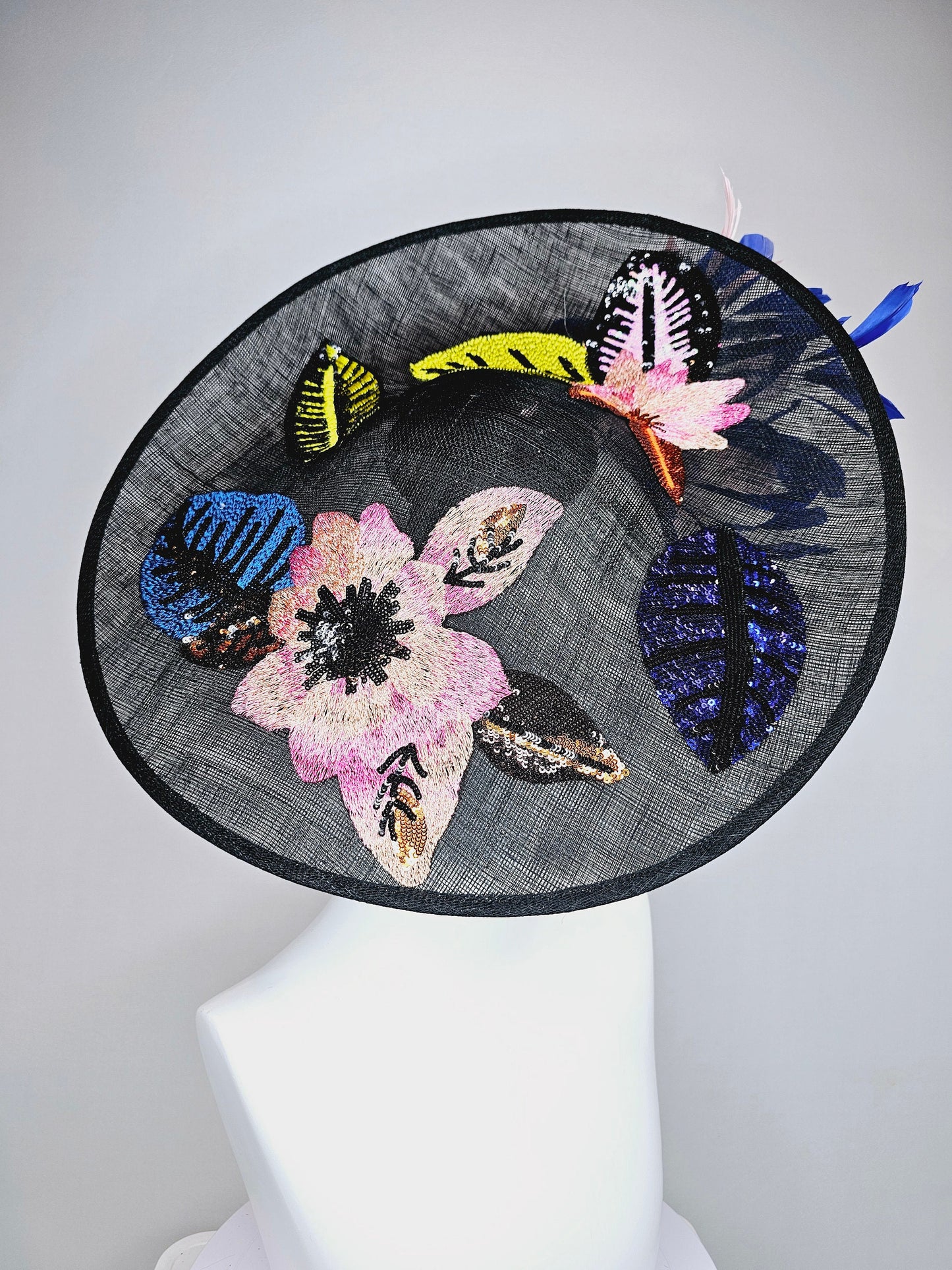 kentucky derby hat fascinator black sinamay saucer with yellow pink blue sequin embroidered flowers and blush pink blue feathers