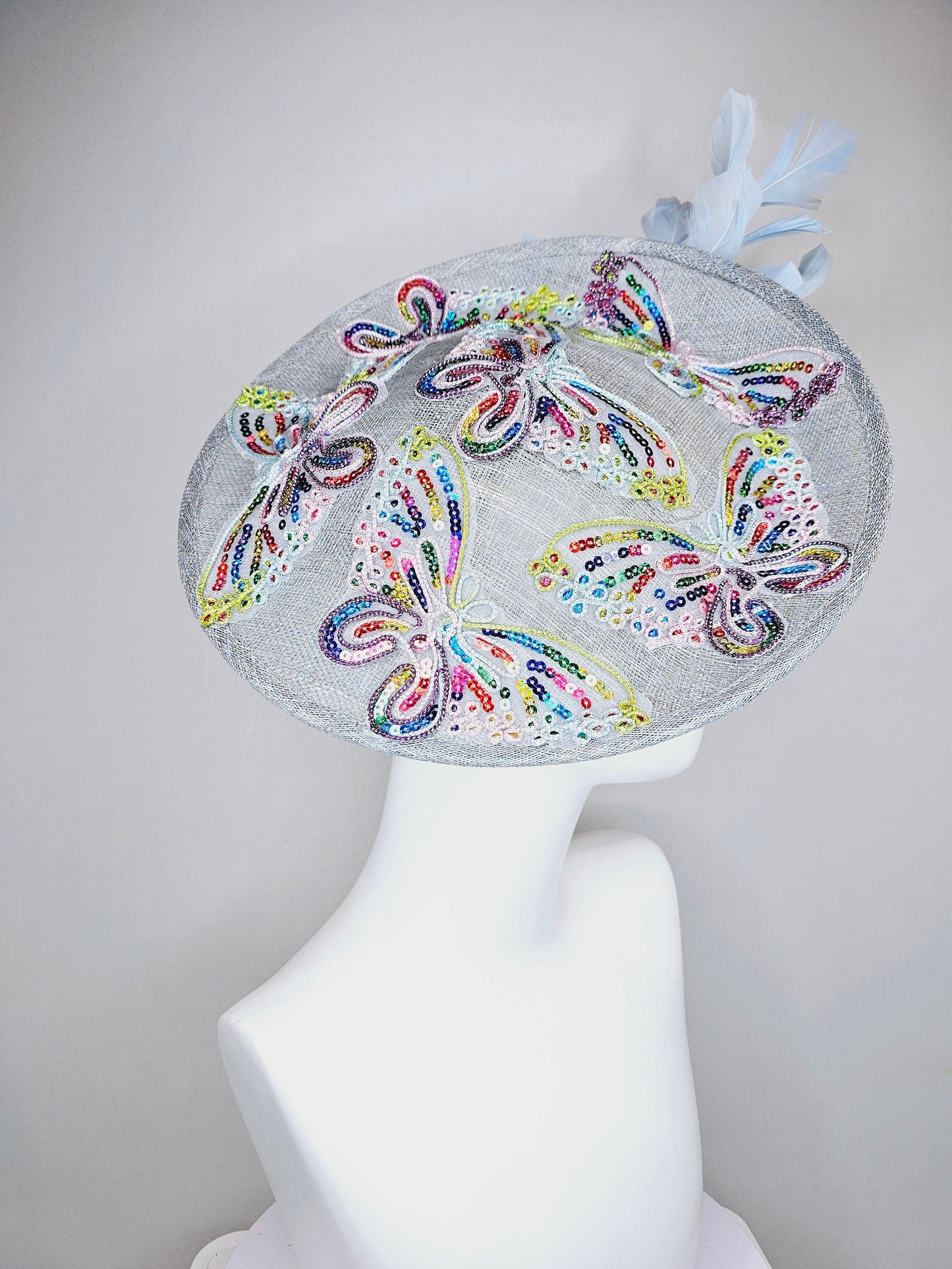 kentucky derby hat fascinator light blue sinamay saucer light blue feathers sequin embroidered rainbow butterflies